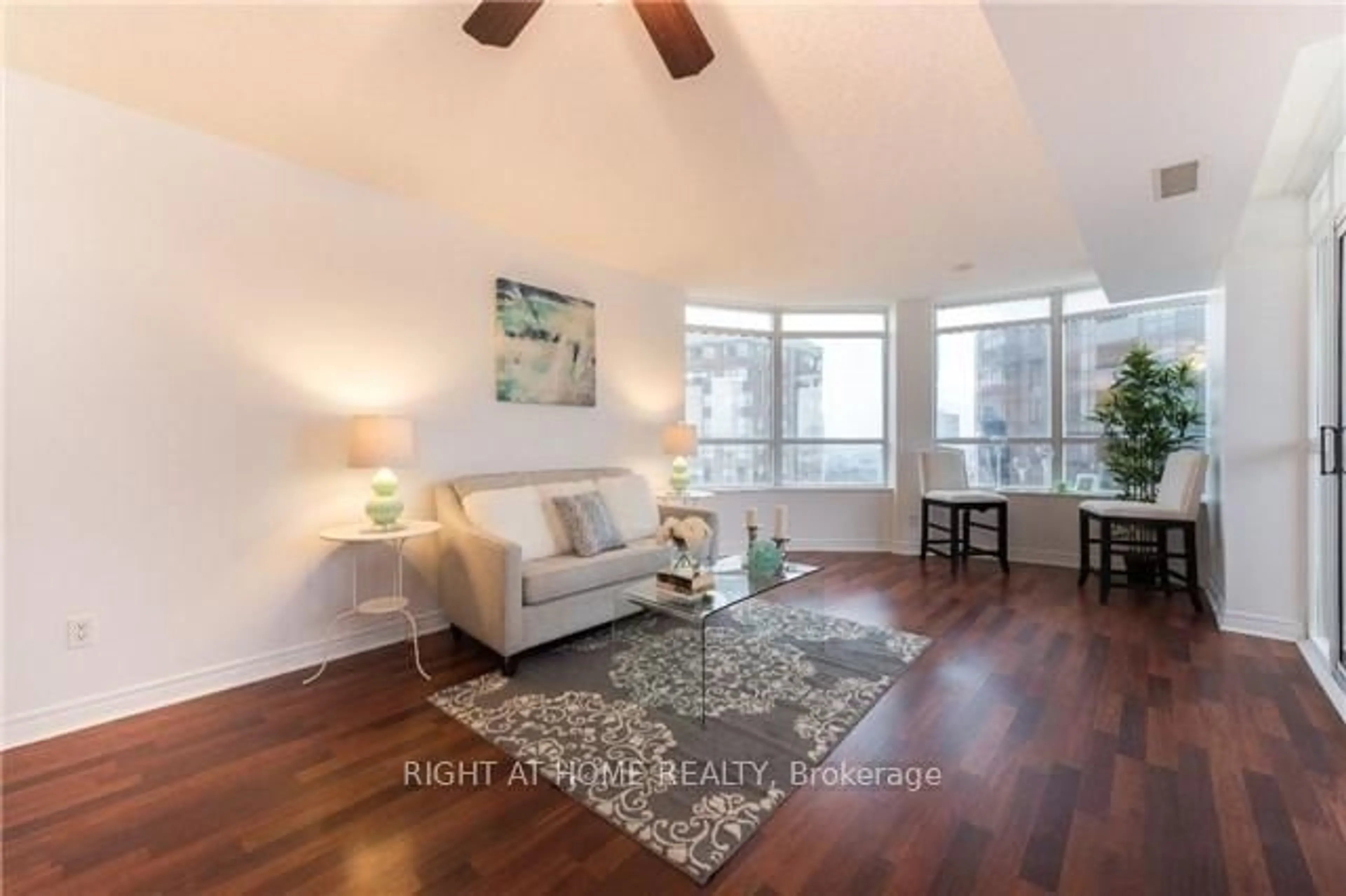 Living room with furniture, wood/laminate floor for 310 Burnhamthorpe Rd #1713, Mississauga Ontario L5B 4P9