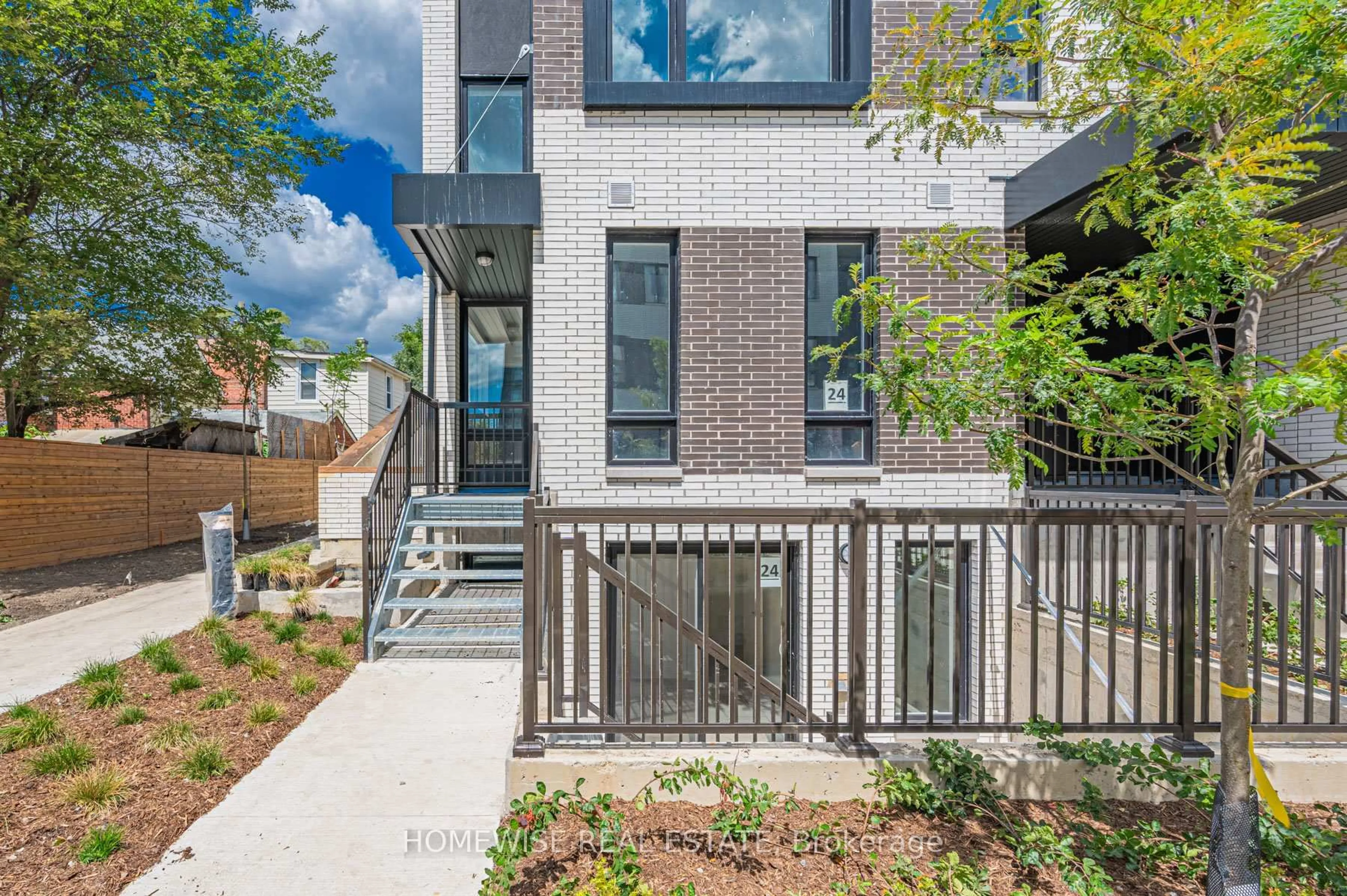 Home with brick exterior material, street for 20 Ed Clark Gdns #TH8, Toronto Ontario M6N 0B5