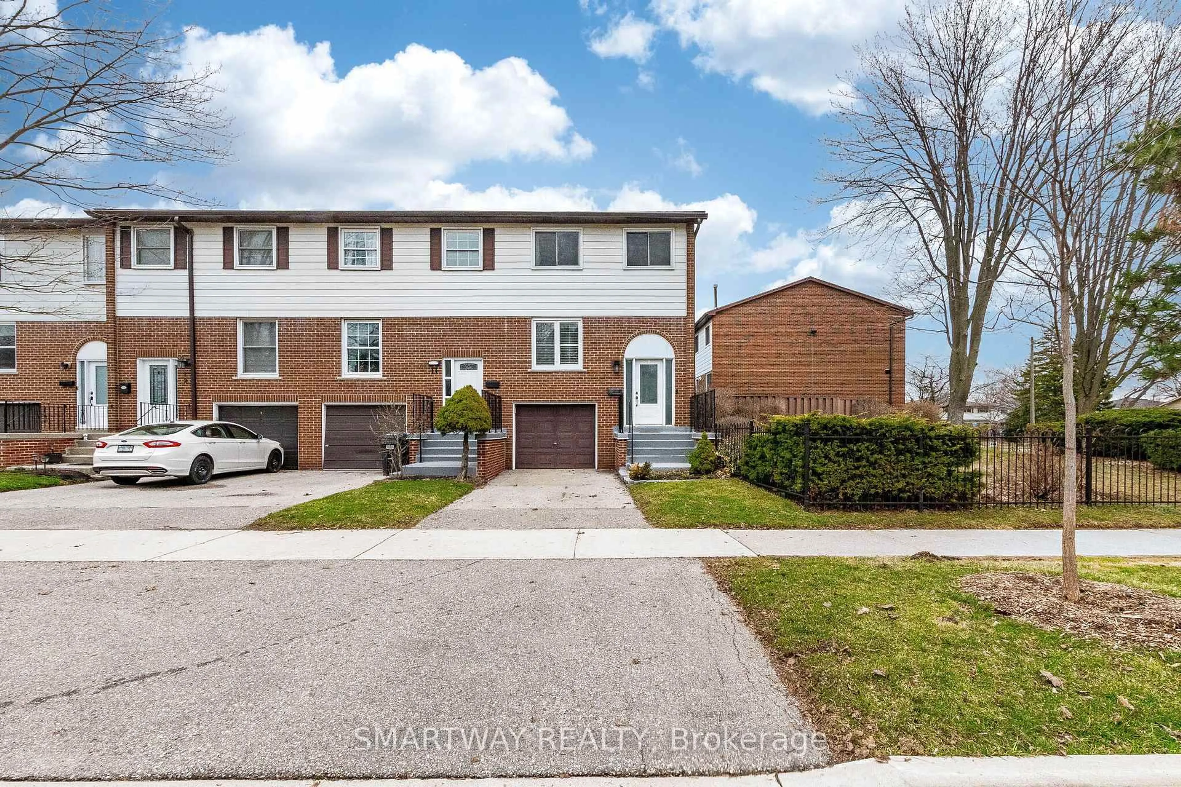 Home with brick exterior material, street for 2445 Homelands Dr #10, Mississauga Ontario L5K 2C6