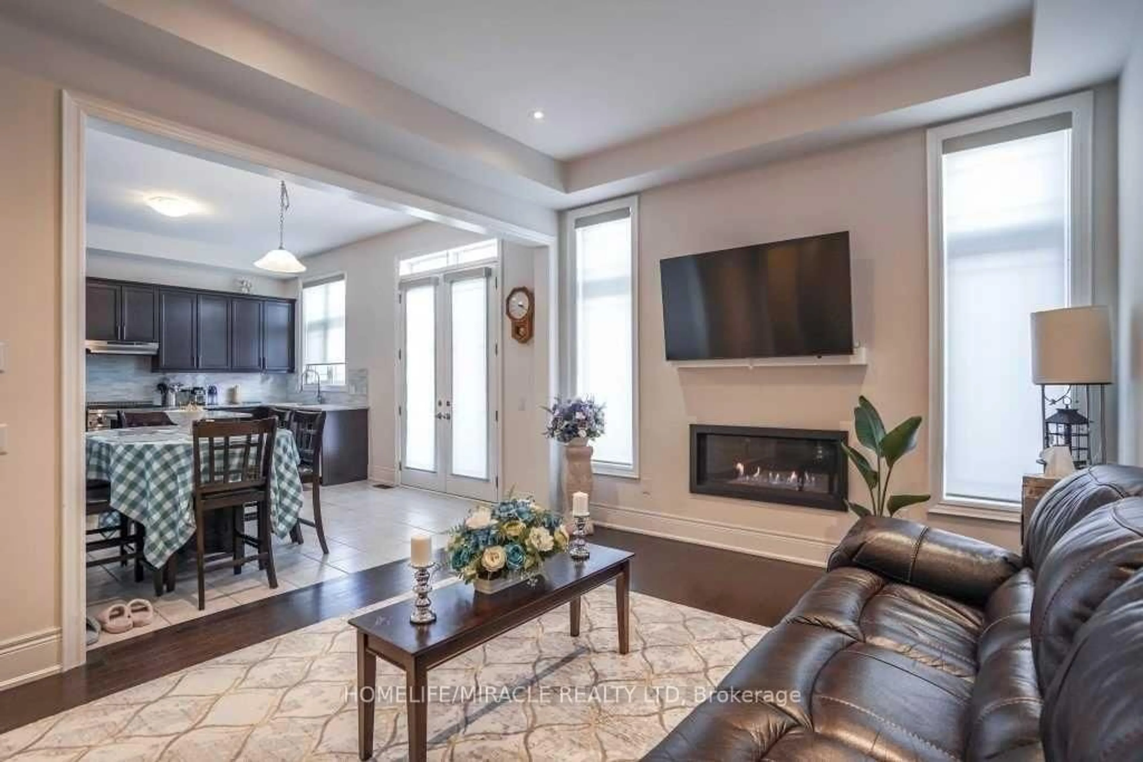 Living room with furniture, ceramic/tile floor for 16 Lyle Way, Brampton Ontario L6X 5P8