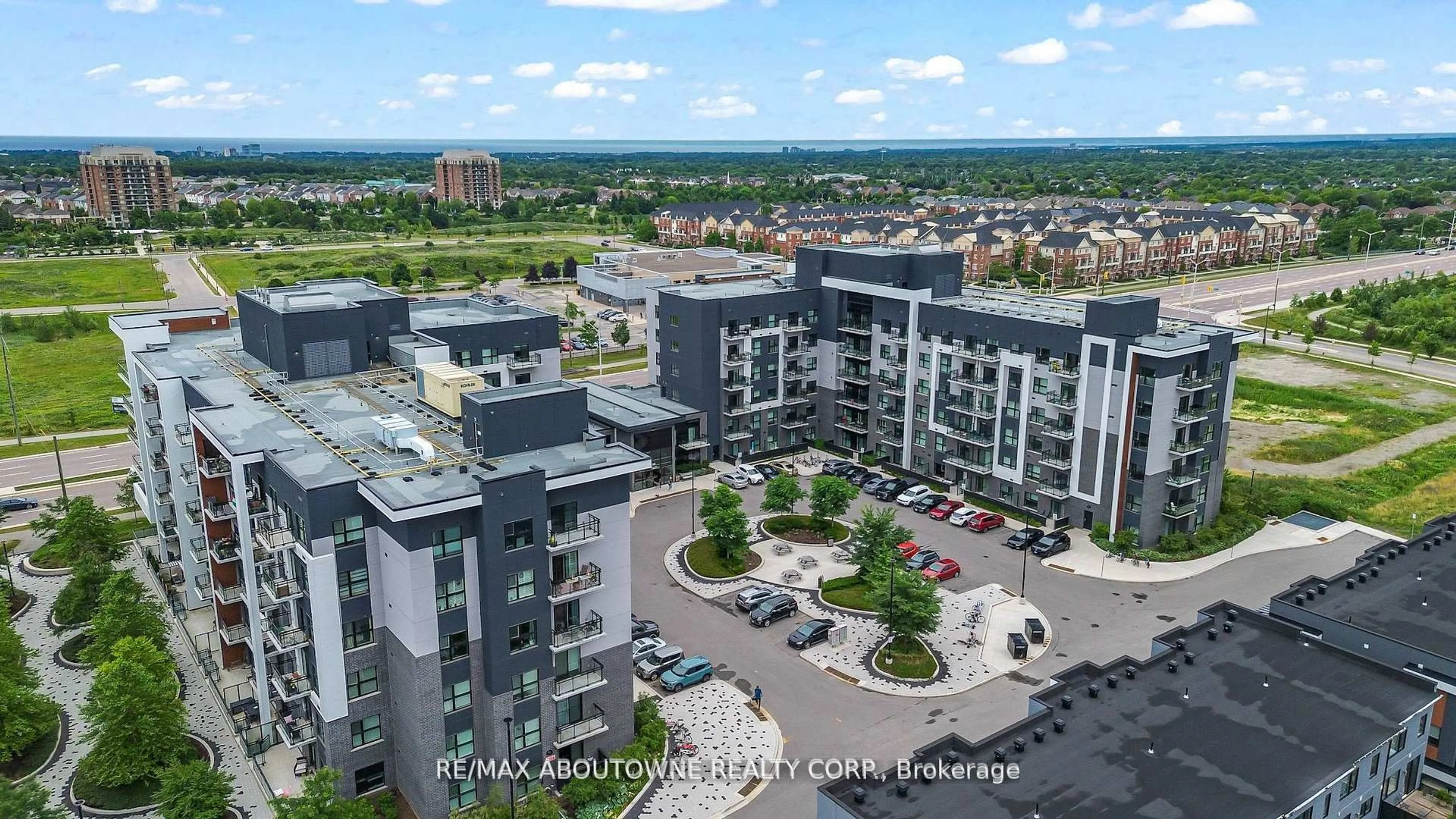 A pic from outside/outdoor area/front of a property/back of a property/a pic from drone, city buildings view from balcony for 102 Grovewood Common #121, Oakville Ontario L6H 0X2