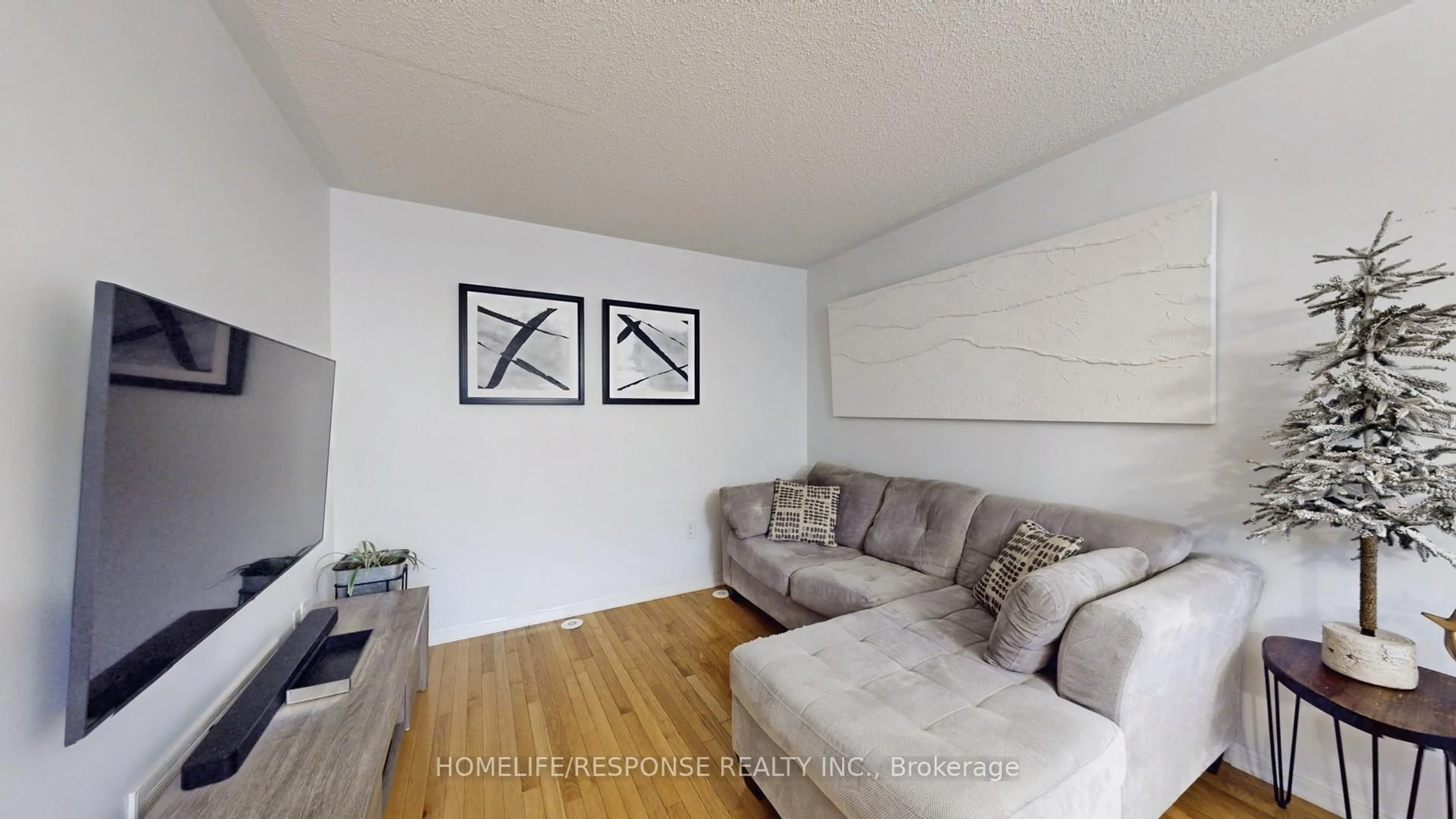 Living room with furniture, wood/laminate floor for 931 Deverell Pl, Milton Ontario L9T 0M3