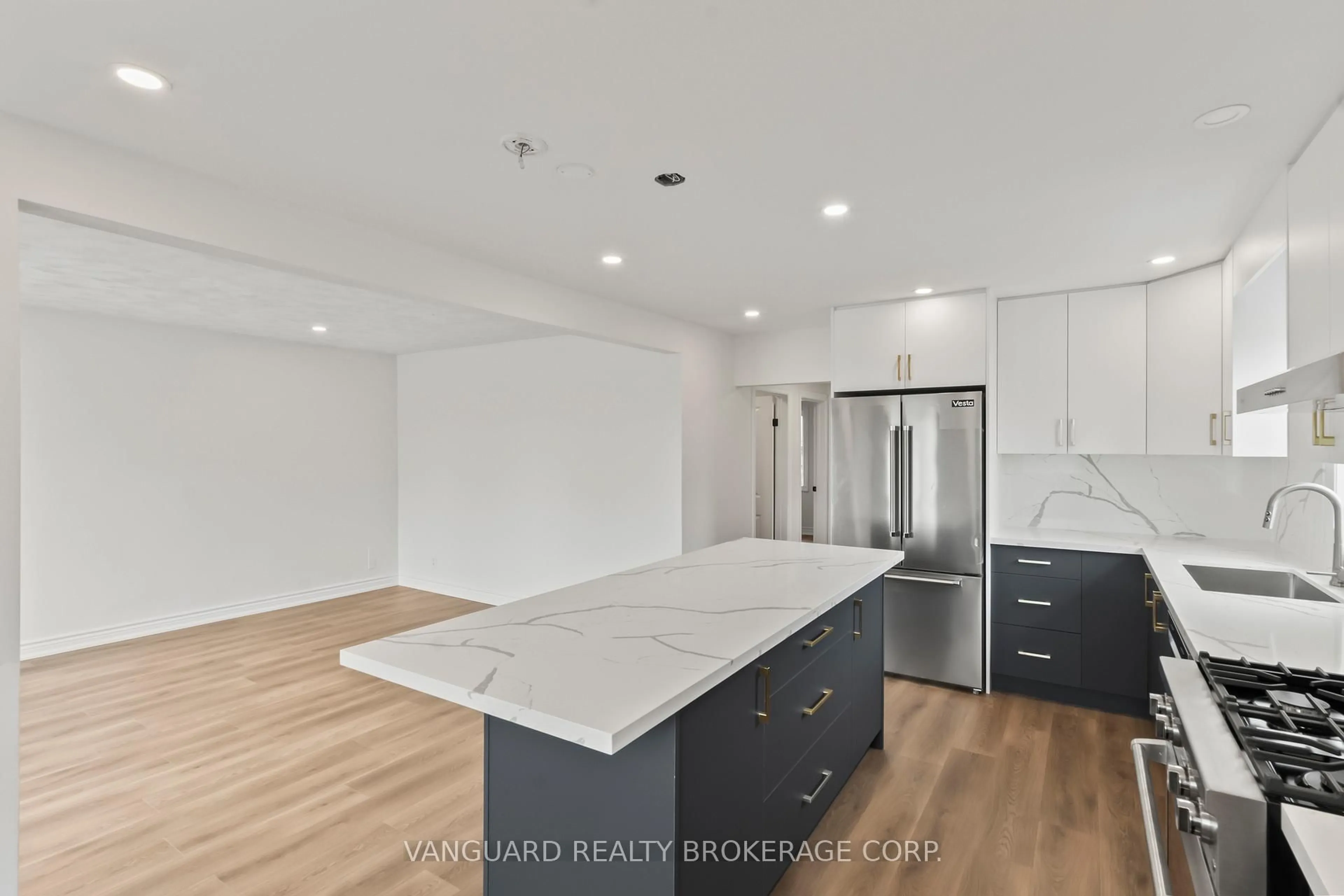 Open concept kitchen, wood/laminate floor for 69 Joyce Pkwy, Toronto Ontario M6B 2T3