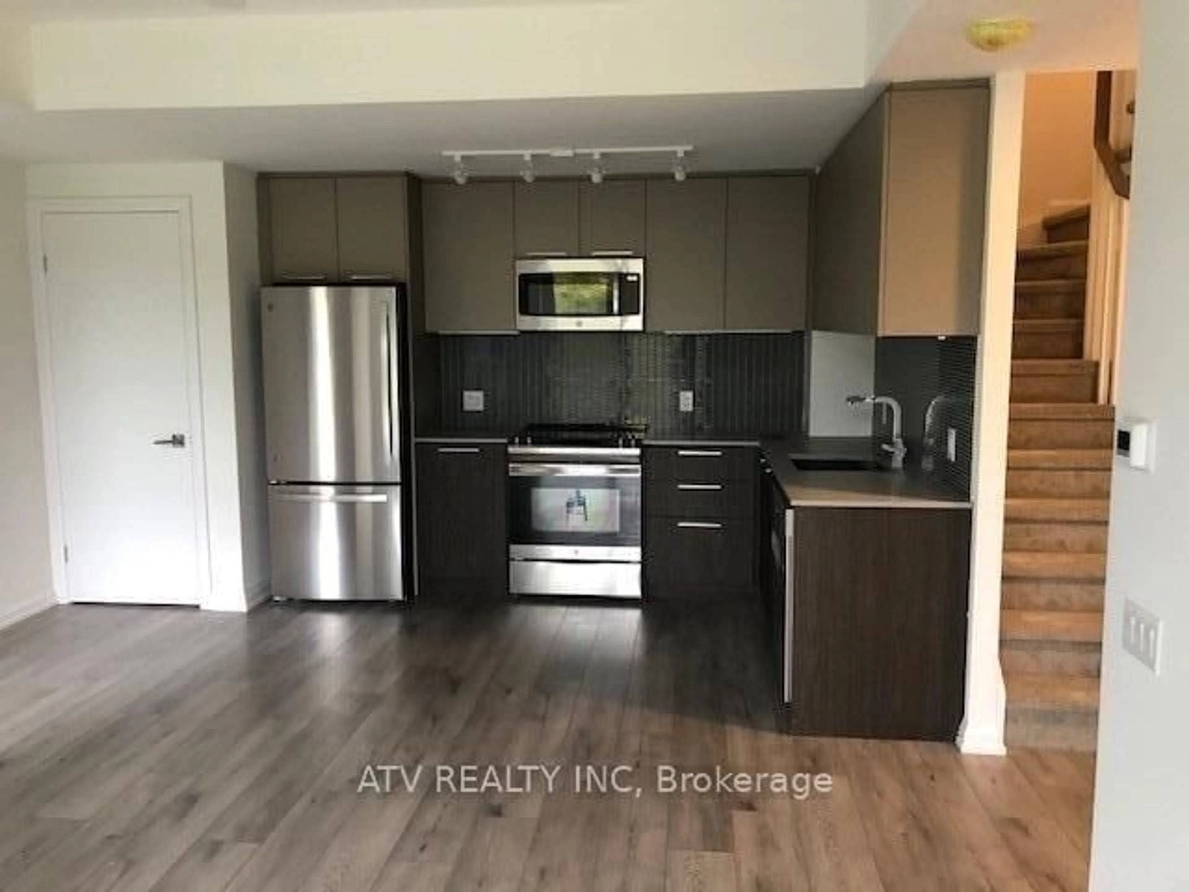 Open concept kitchen, wood/laminate floor for 10 Brin Dr #TH17, Toronto Ontario M8X 0B3