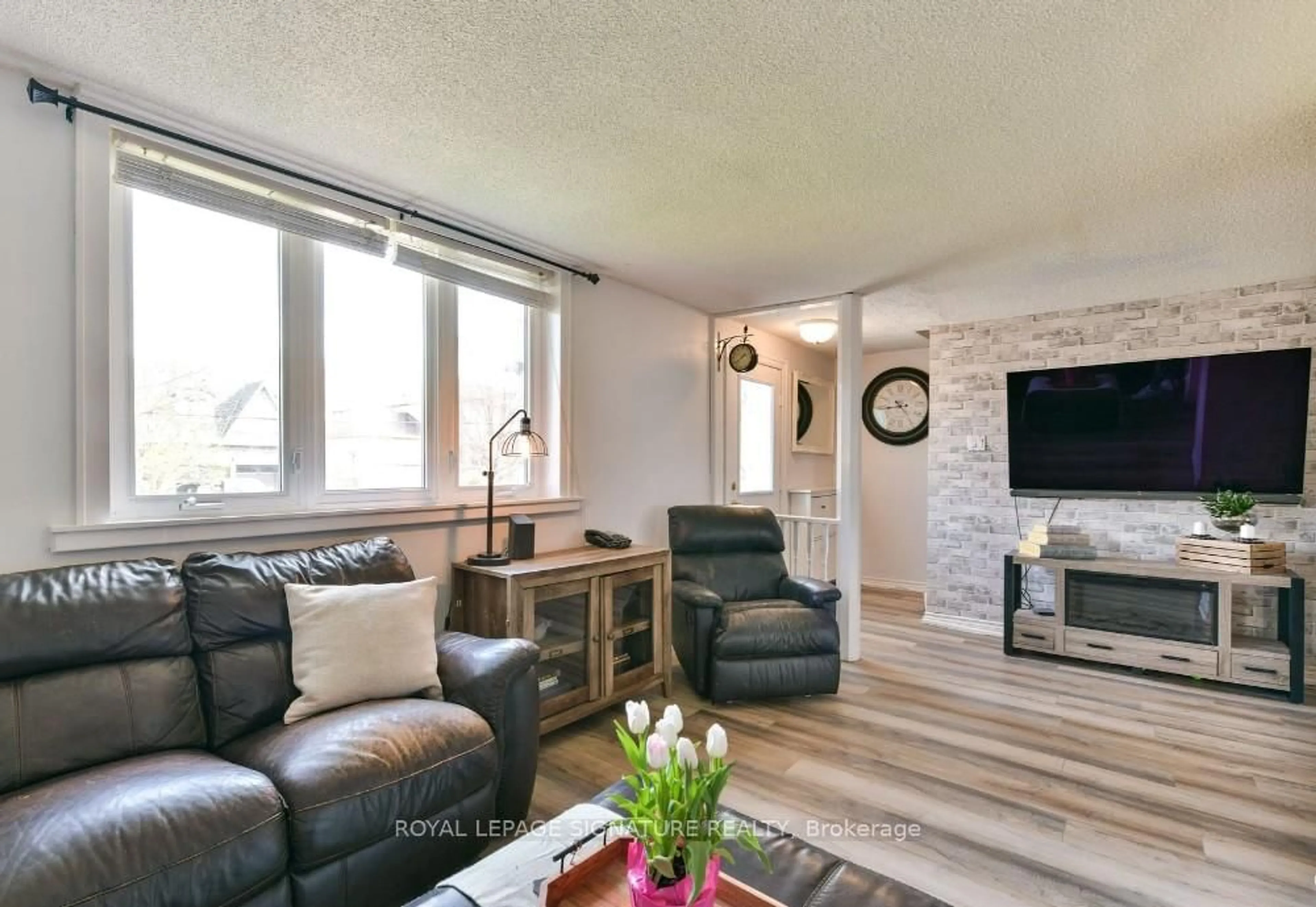 Living room with furniture, wood/laminate floor for 219 Angelene St, Mississauga Ontario L5G 1X3