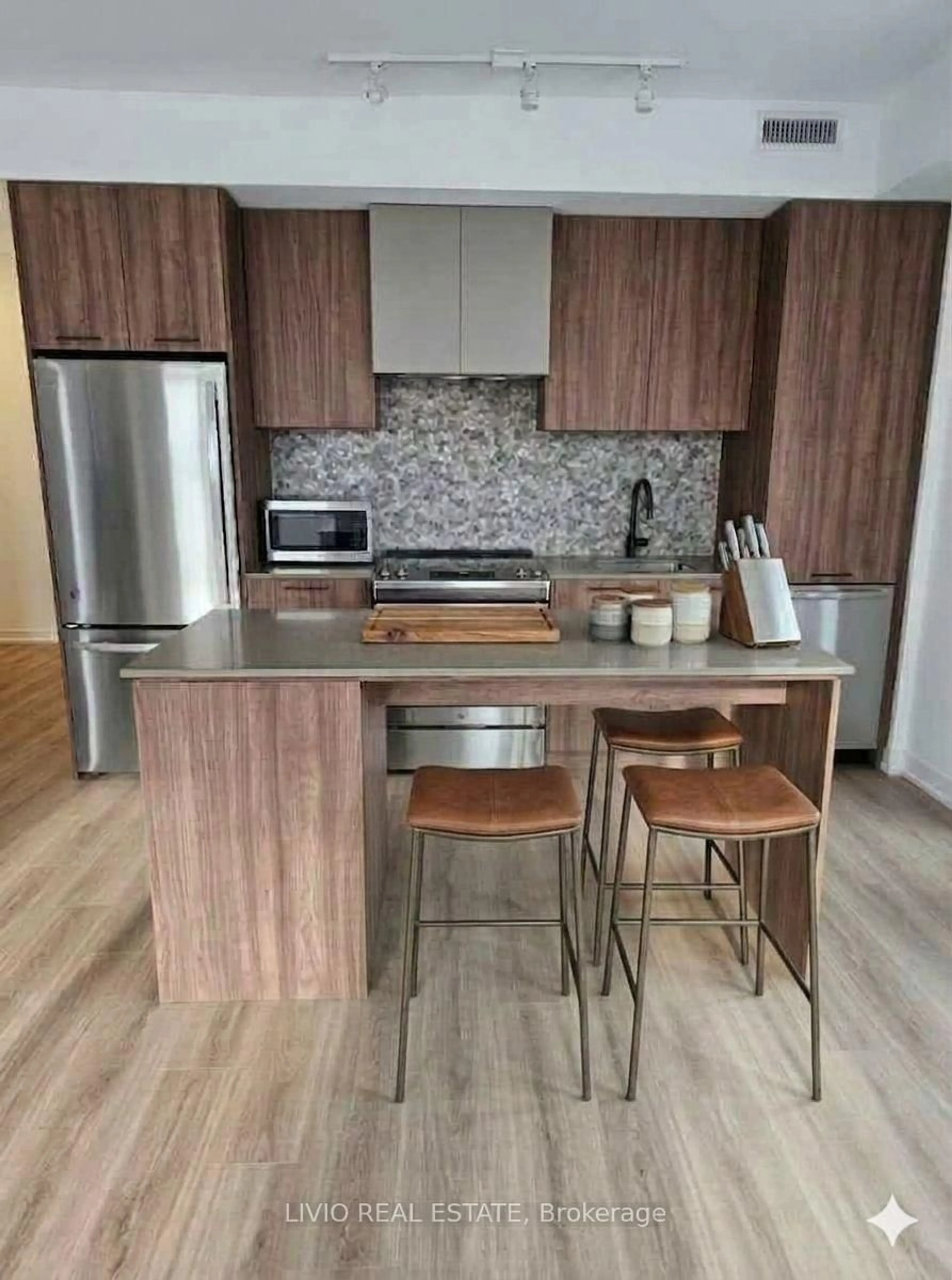 Open concept kitchen, wood/laminate floor for 10 lagerfeld Dr #505, Brampton Ontario L7A 5L3