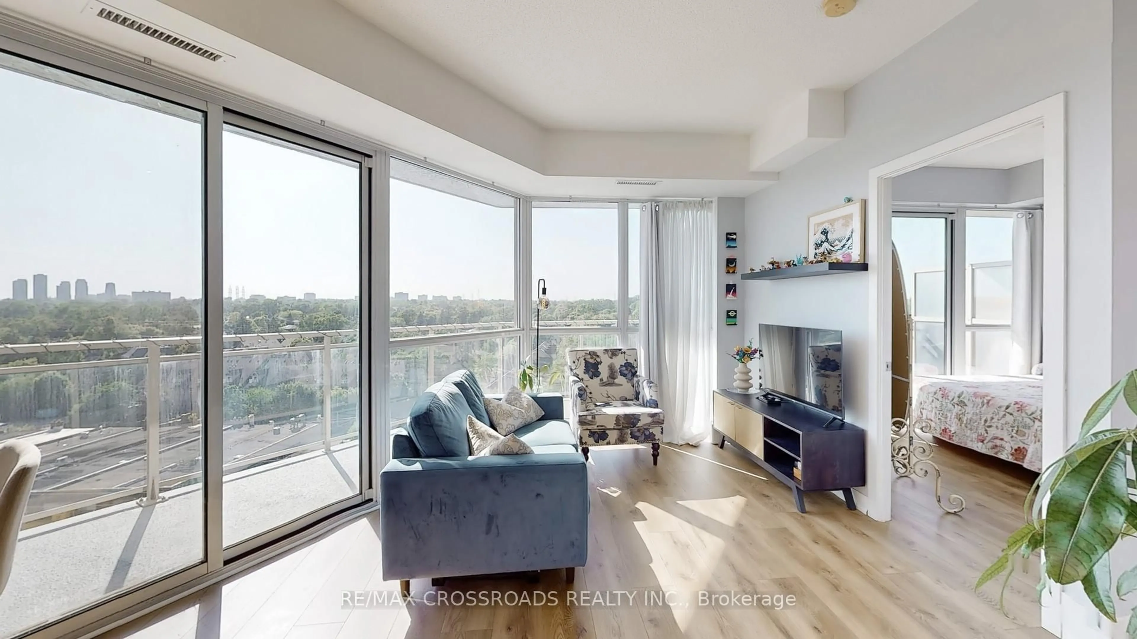 Living room with furniture, wood/laminate floor for 5101 Dundas St #810, Toronto Ontario M9A 1C1