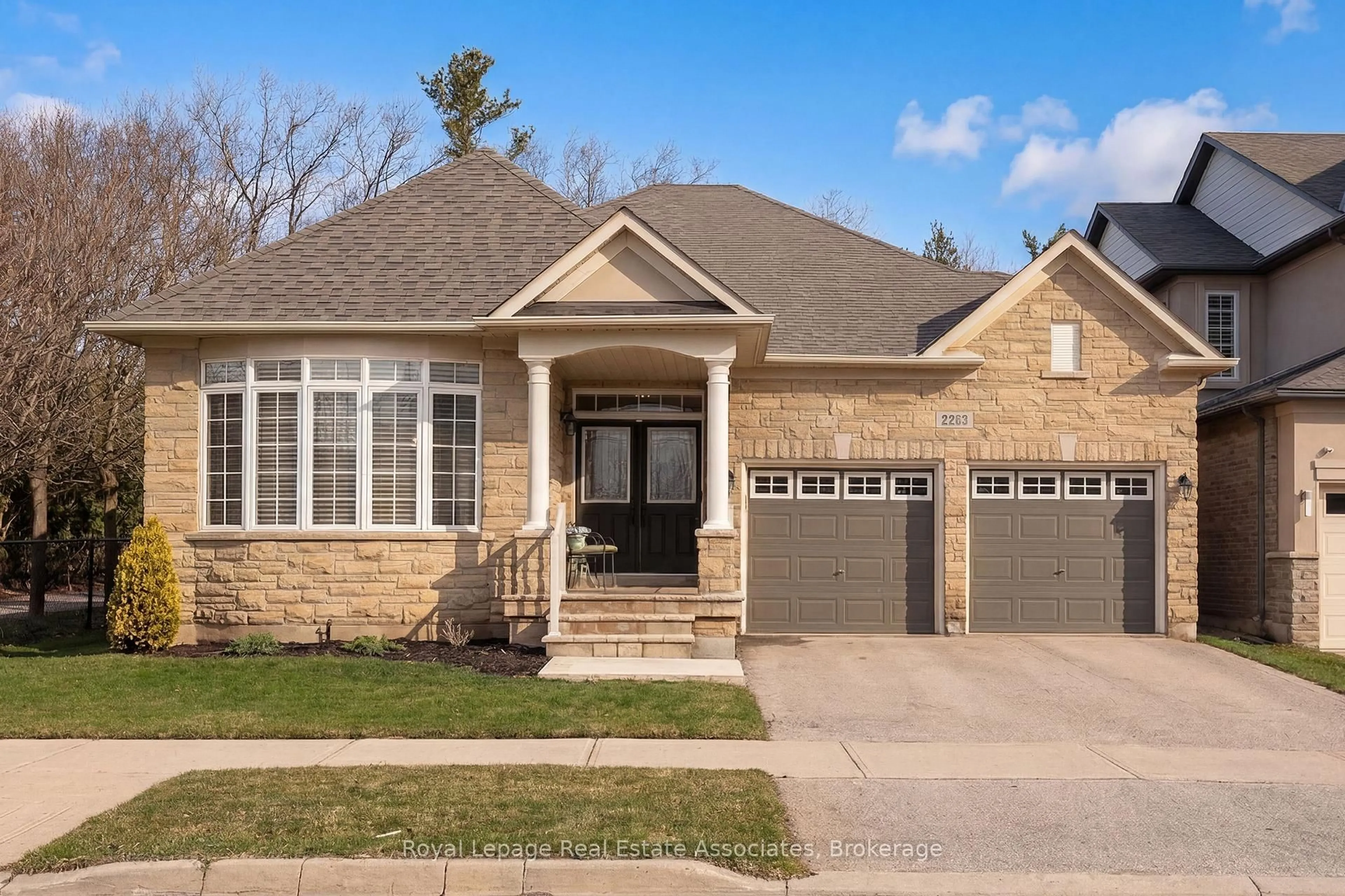 Home with brick exterior material, street for 2263 Wuthering Heights Way, Oakville Ontario L6M 0A6