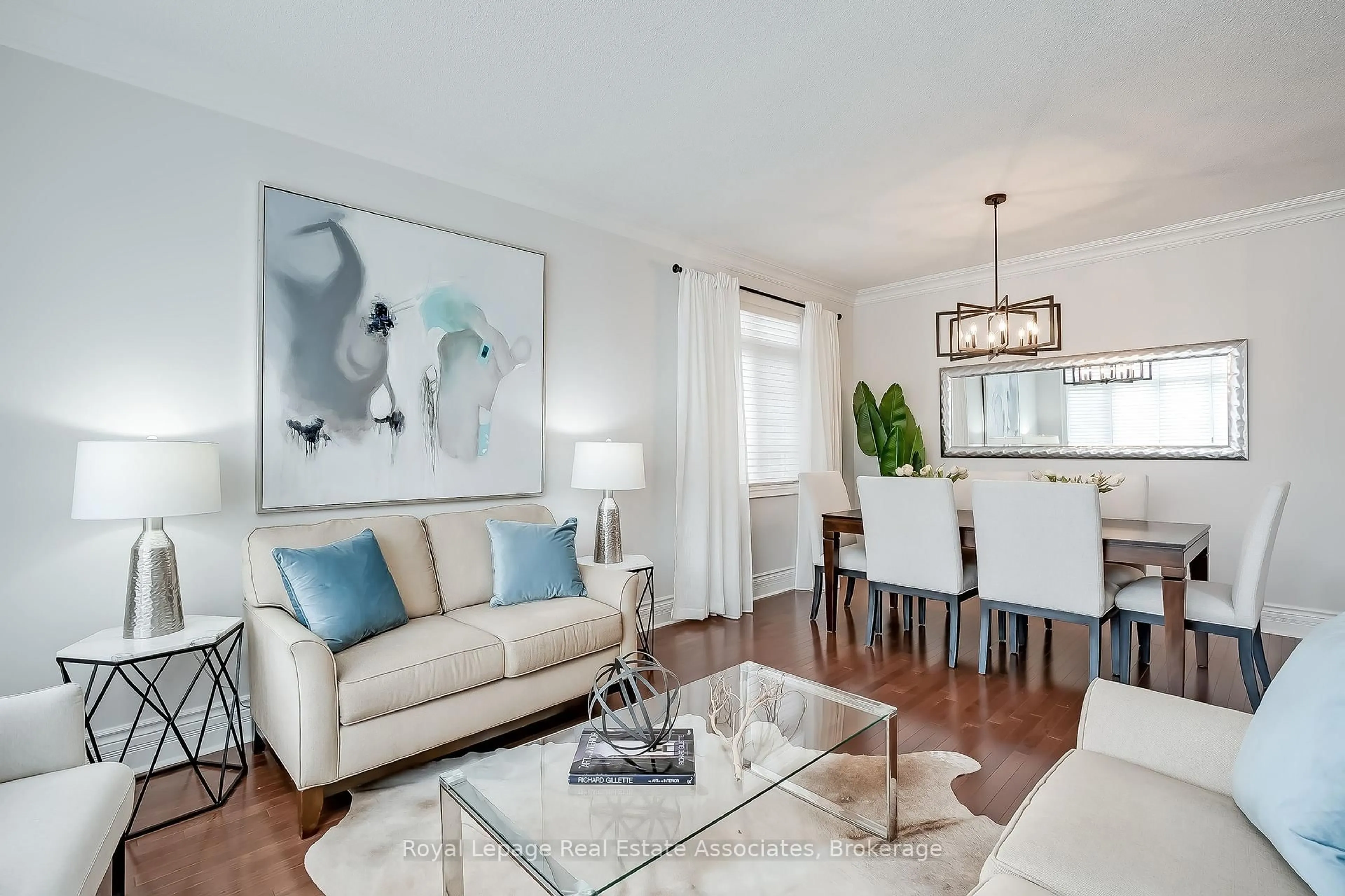 Living room with furniture, wood/laminate floor for 2263 Wuthering Heights Way, Oakville Ontario L6M 0A6