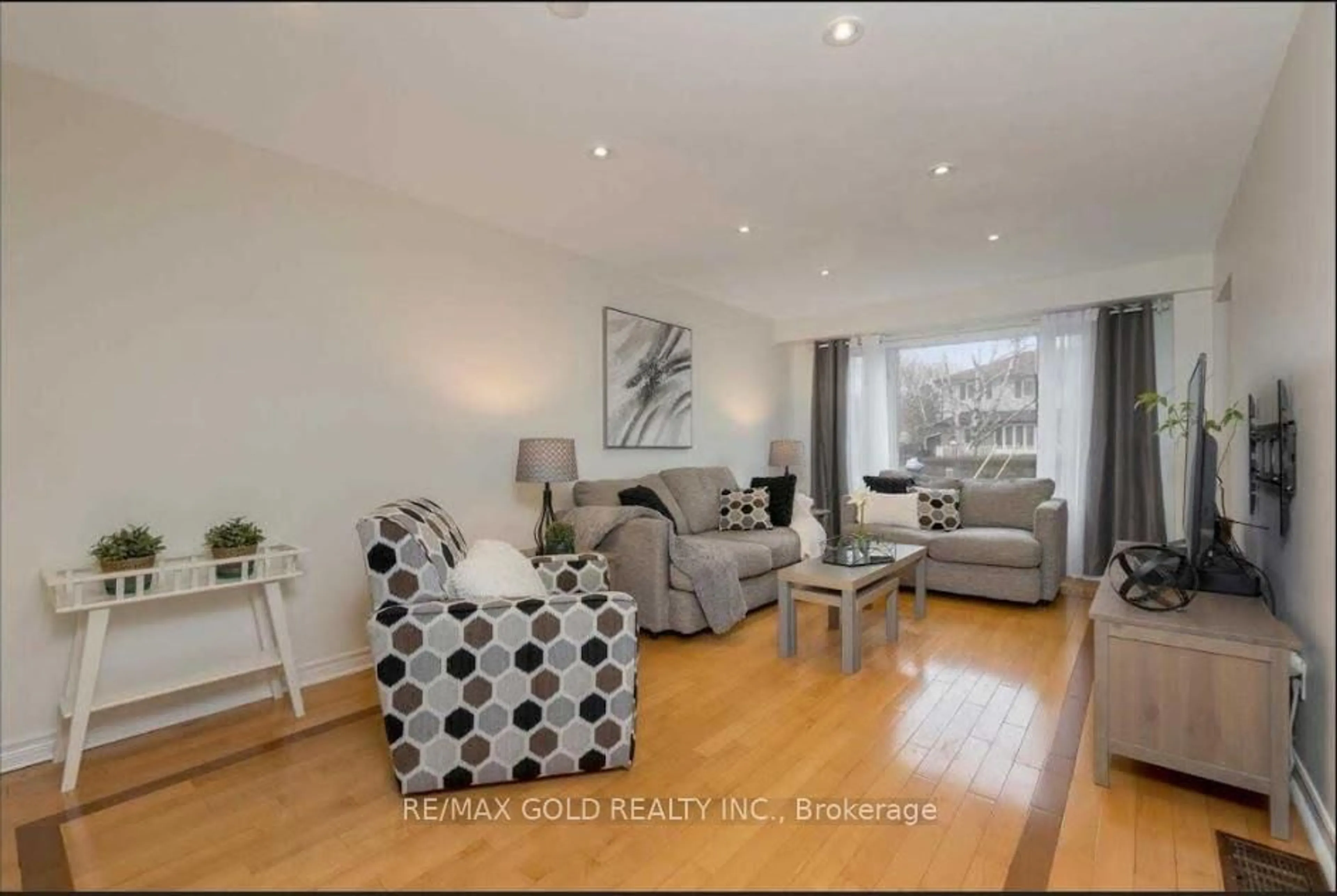 Living room with furniture, wood/laminate floor for 59 Royce Ave, Brampton Ontario L6Y 1J8