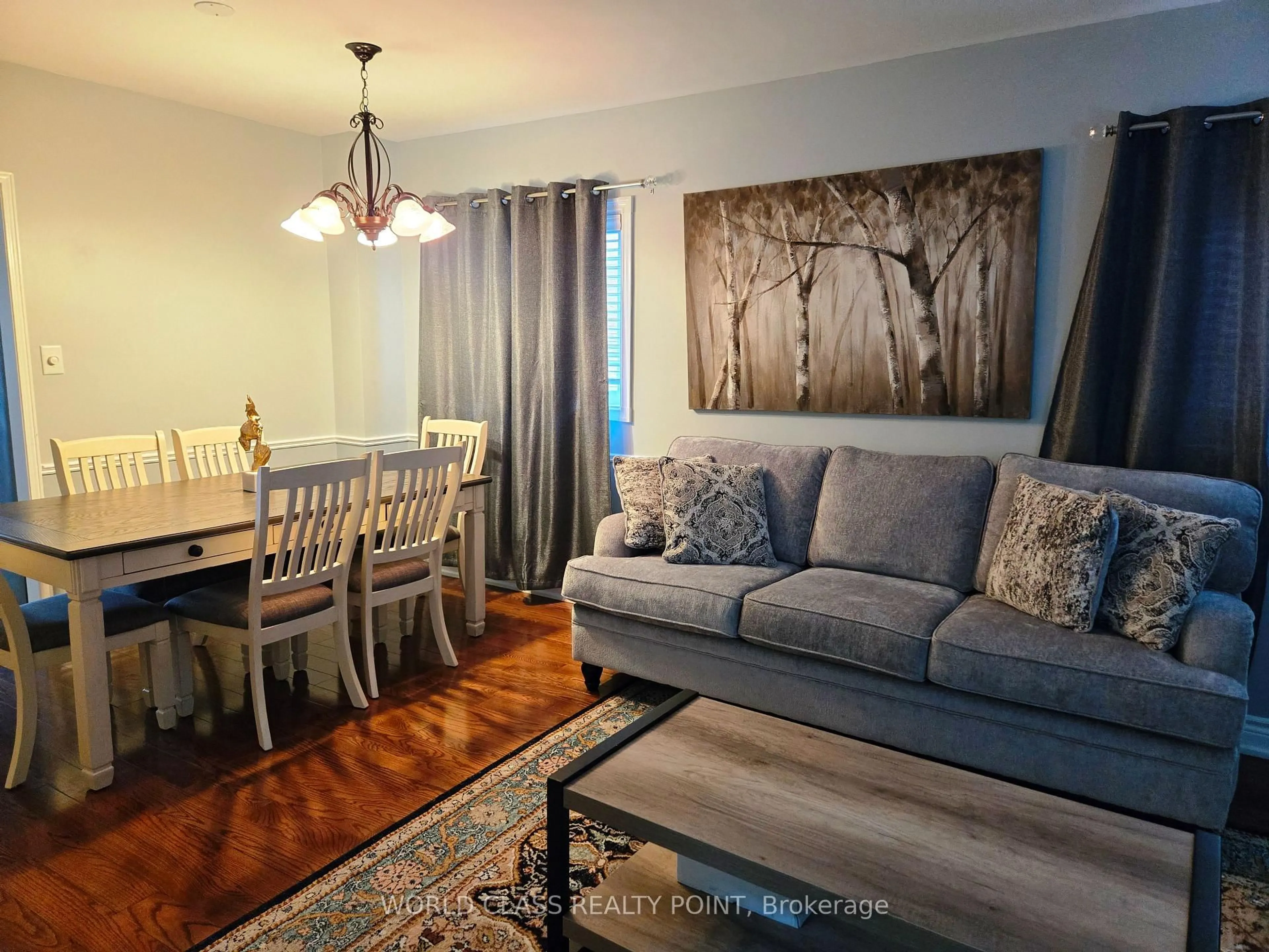 Living room with furniture, wood/laminate floor for 6136 Ford Rd, Mississauga Ontario L5V 1X1