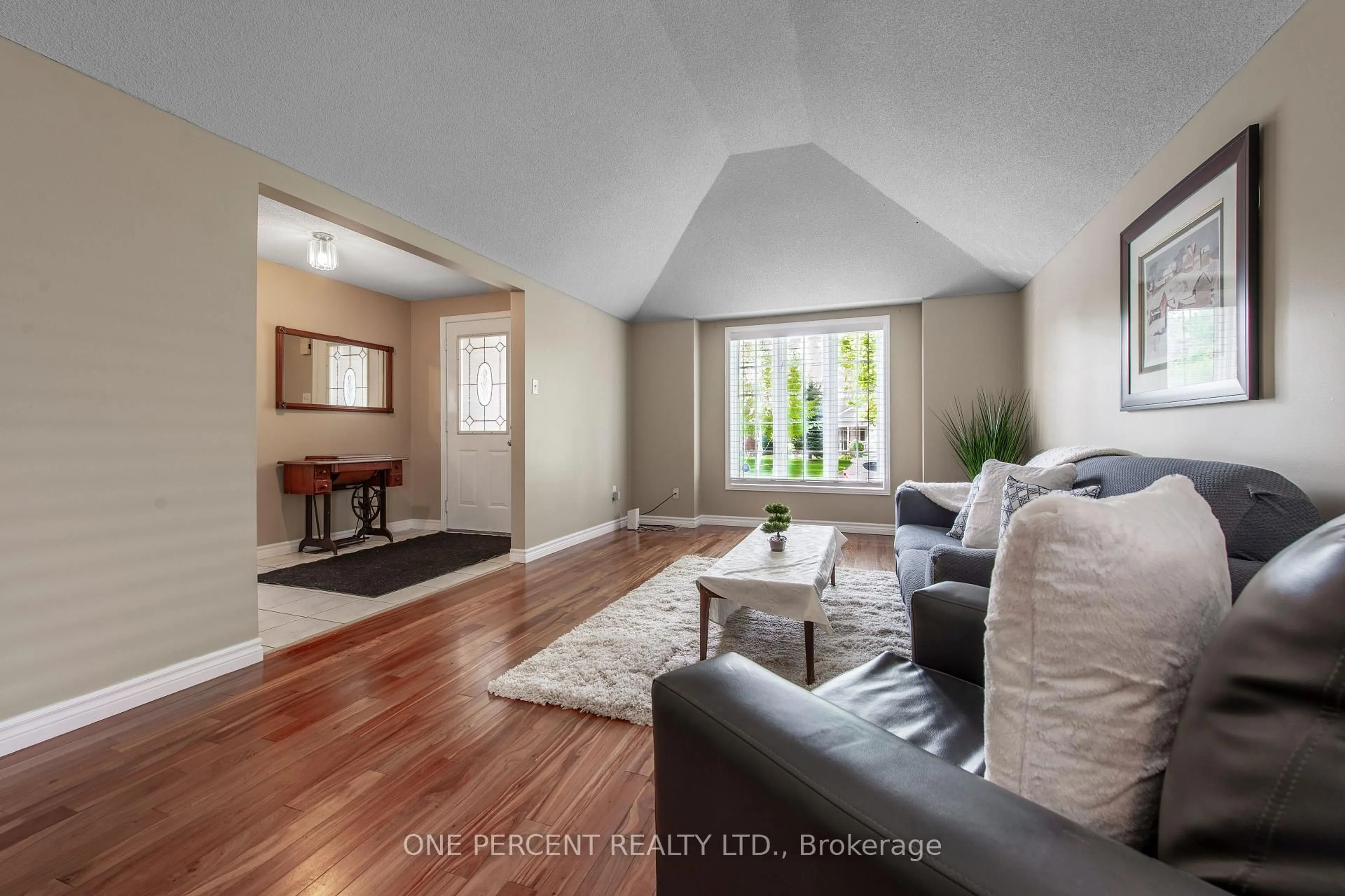 Living room with furniture, wood/laminate floor for 240 Walsh Cres, Orangeville Ontario L9W 4T1