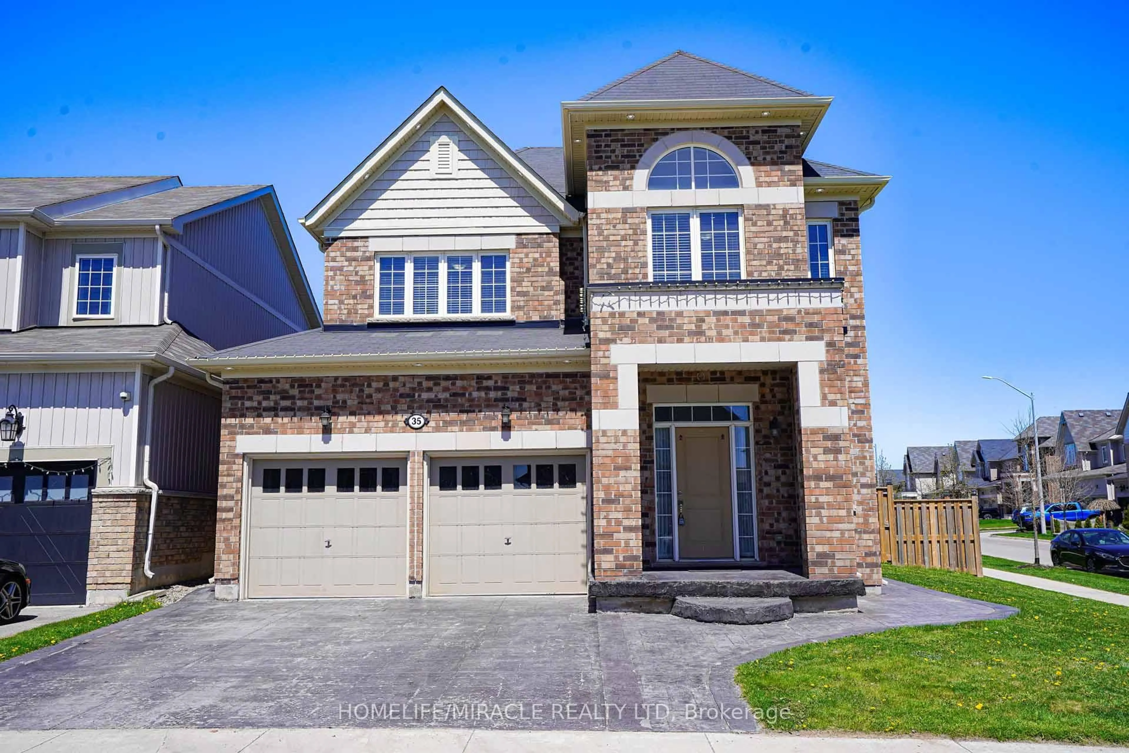 Home with brick exterior material, street for 35 Drew Brown Blvd, Orangeville Ontario L9W 6Z6