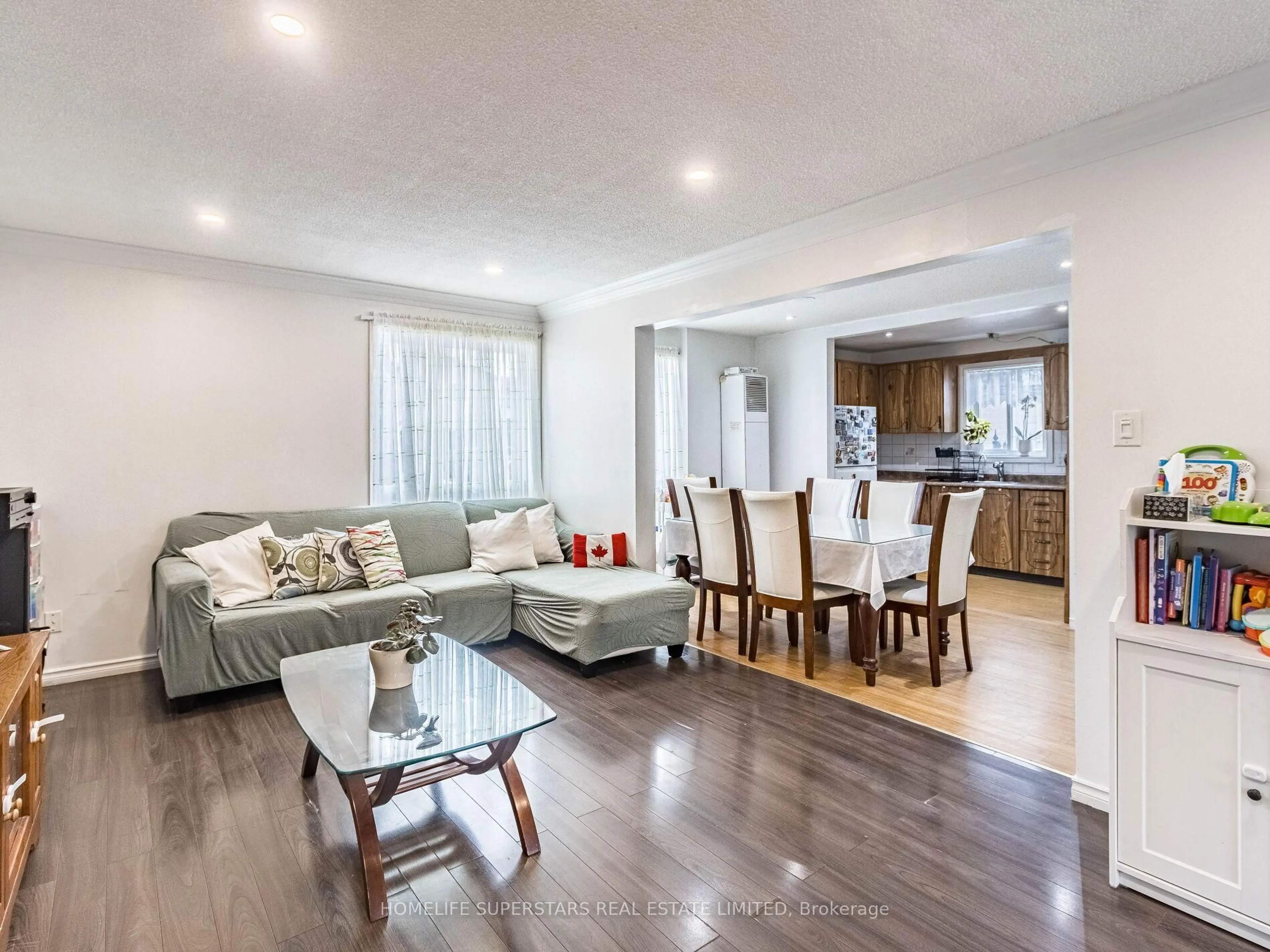 Living room with furniture, wood/laminate floor for 3 Haley Crt, Brampton Ontario L6S 1N6