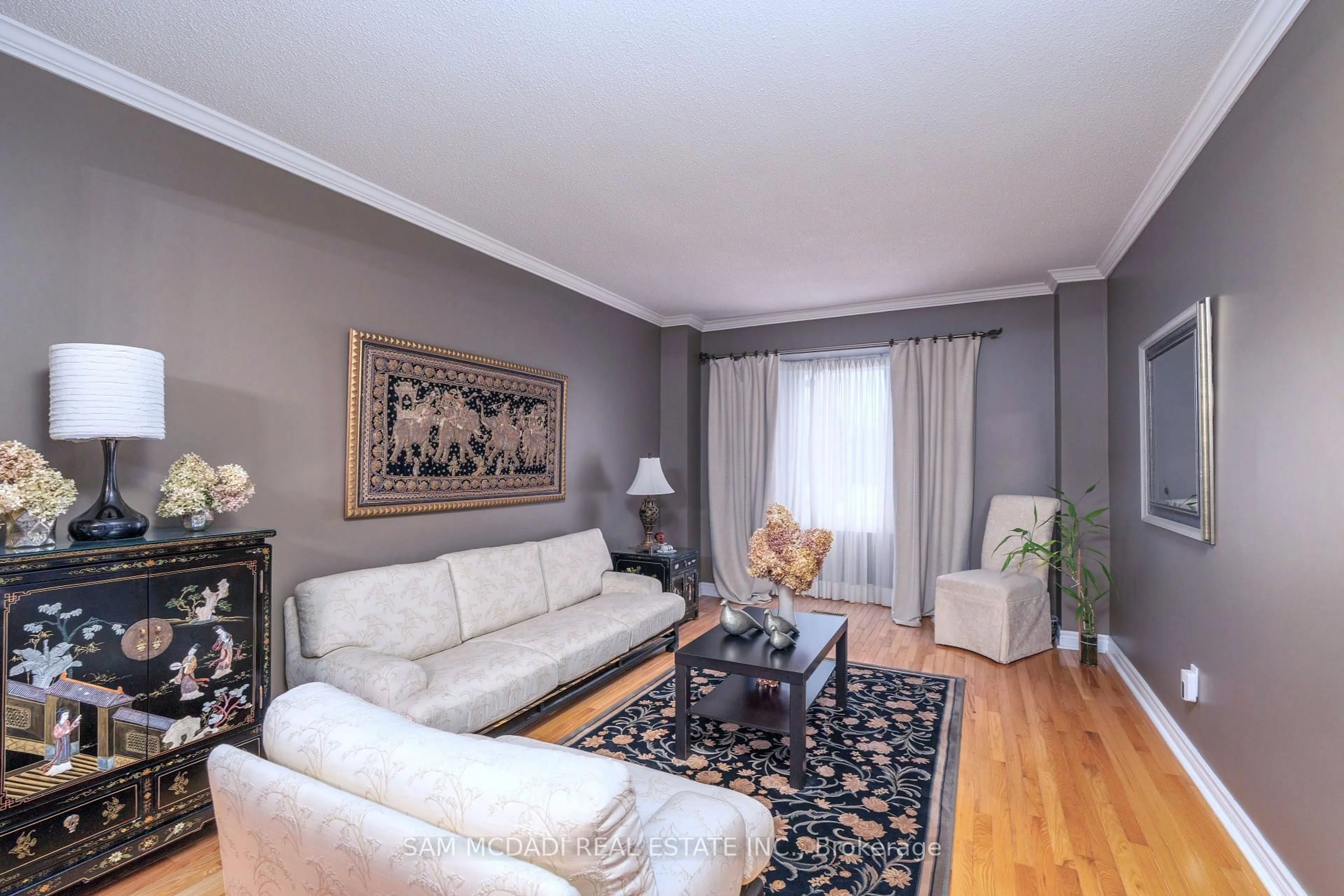 Living room with furniture, wood/laminate floor for 69 Parkside Dr, Brampton Ontario L6Y 3A1