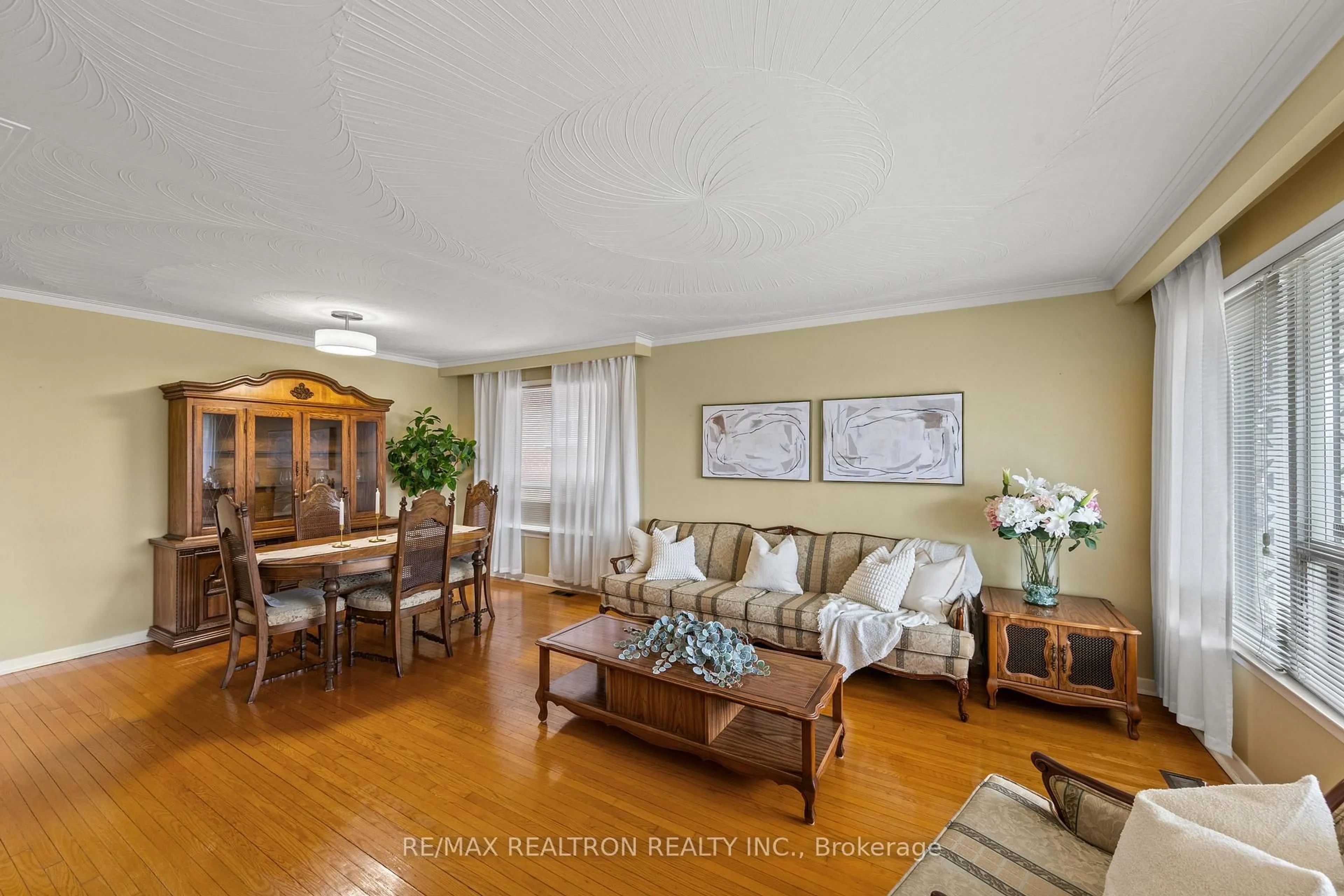 Living room with furniture, wood/laminate floor for 1144 Glengrove Ave, Toronto Ontario M6B 2K4