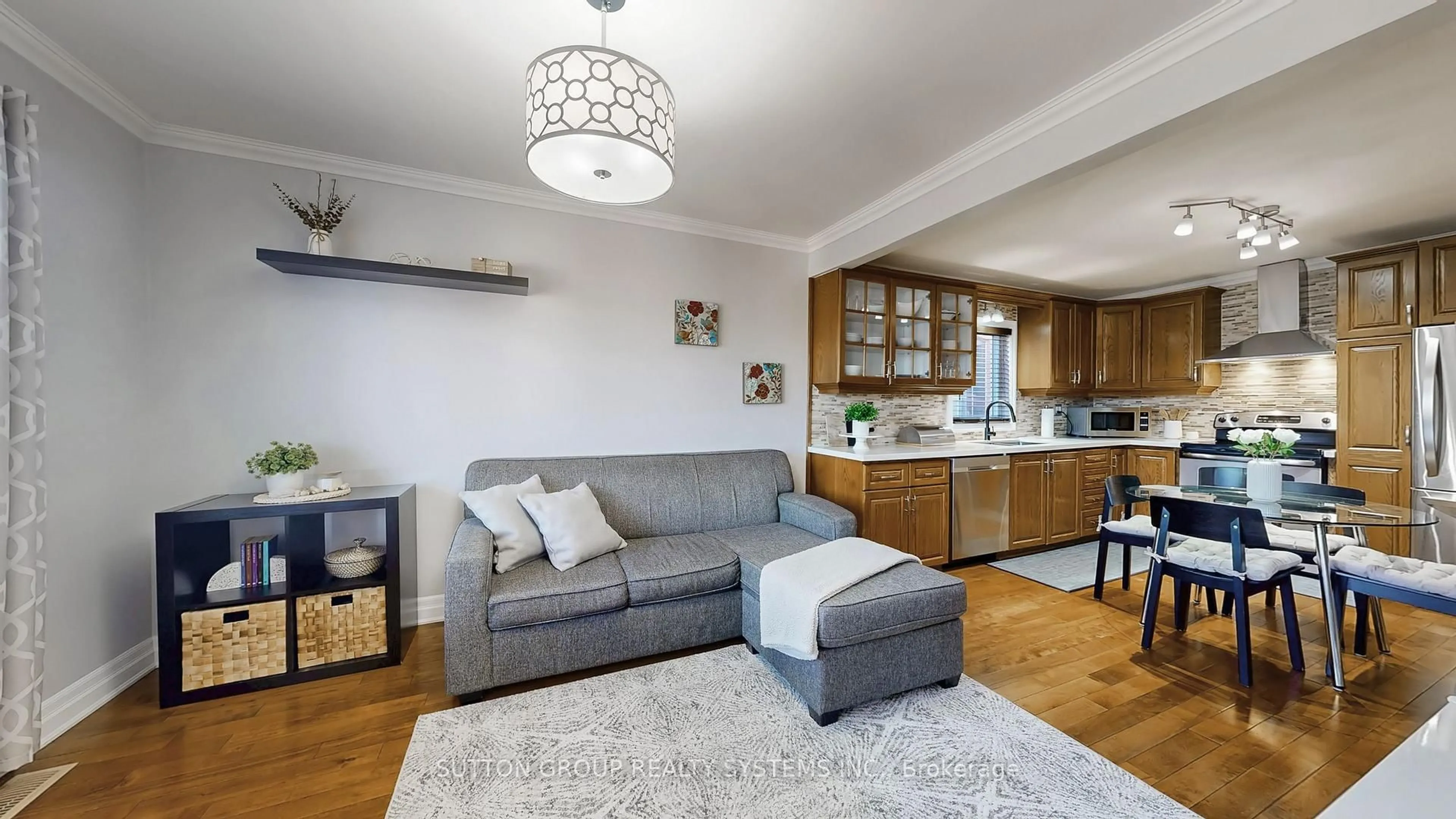 Living room with furniture, wood/laminate floor for 38 Donald Ave, Toronto Ontario M6M 1K1