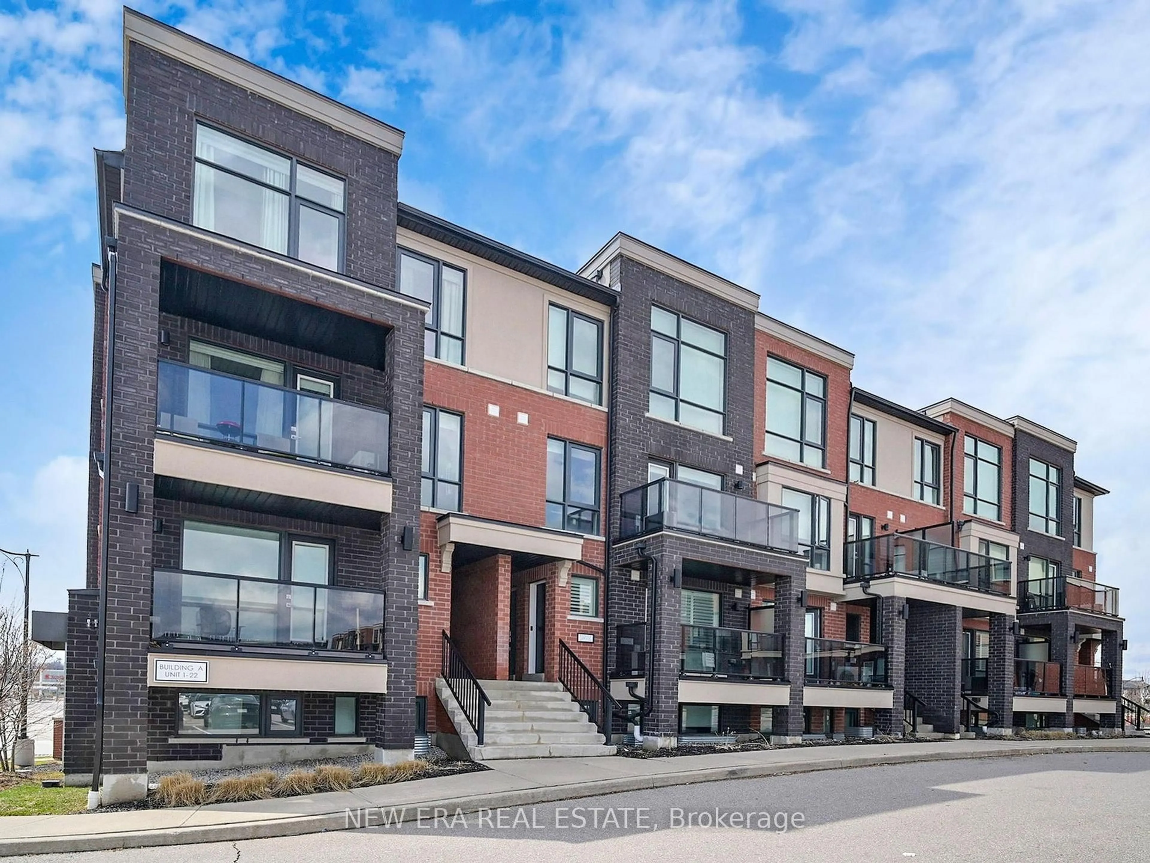 Home with brick exterior material, street for 100 Dufay Rd #12, Brampton Ontario L7A 4S3