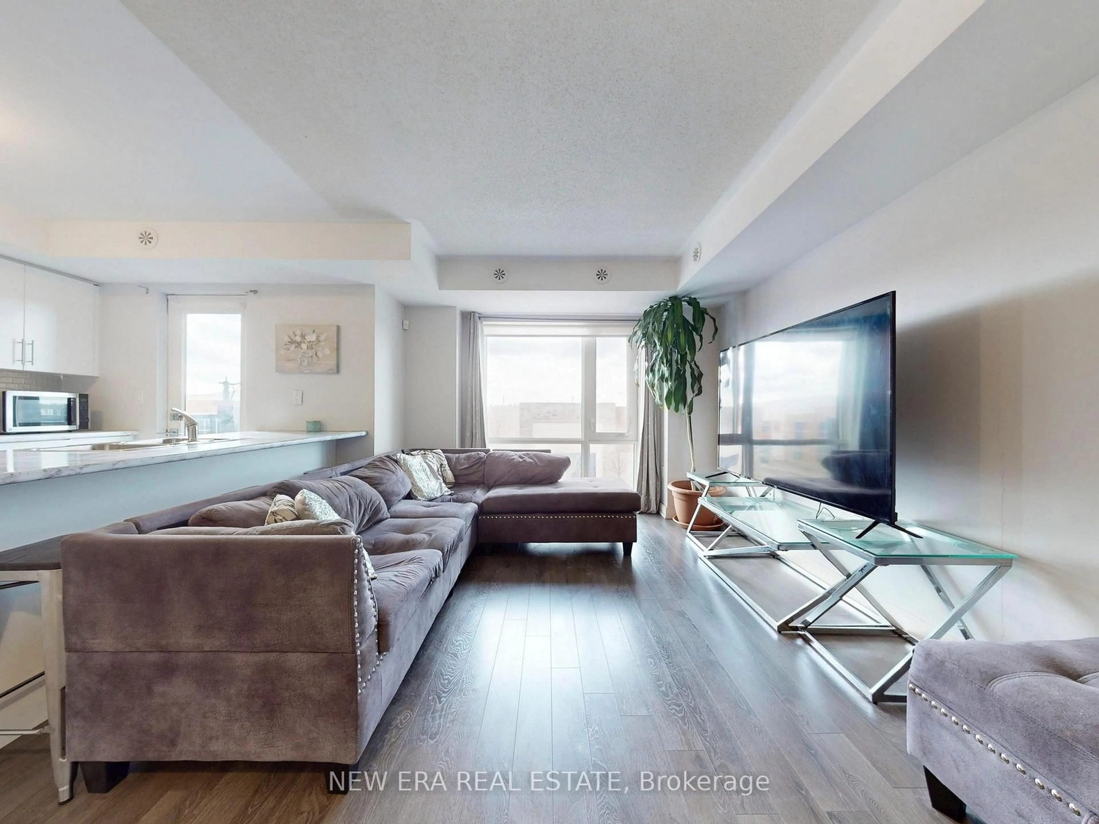 Living room with furniture, unknown for 100 Dufay Rd #12, Brampton Ontario L7A 4S3