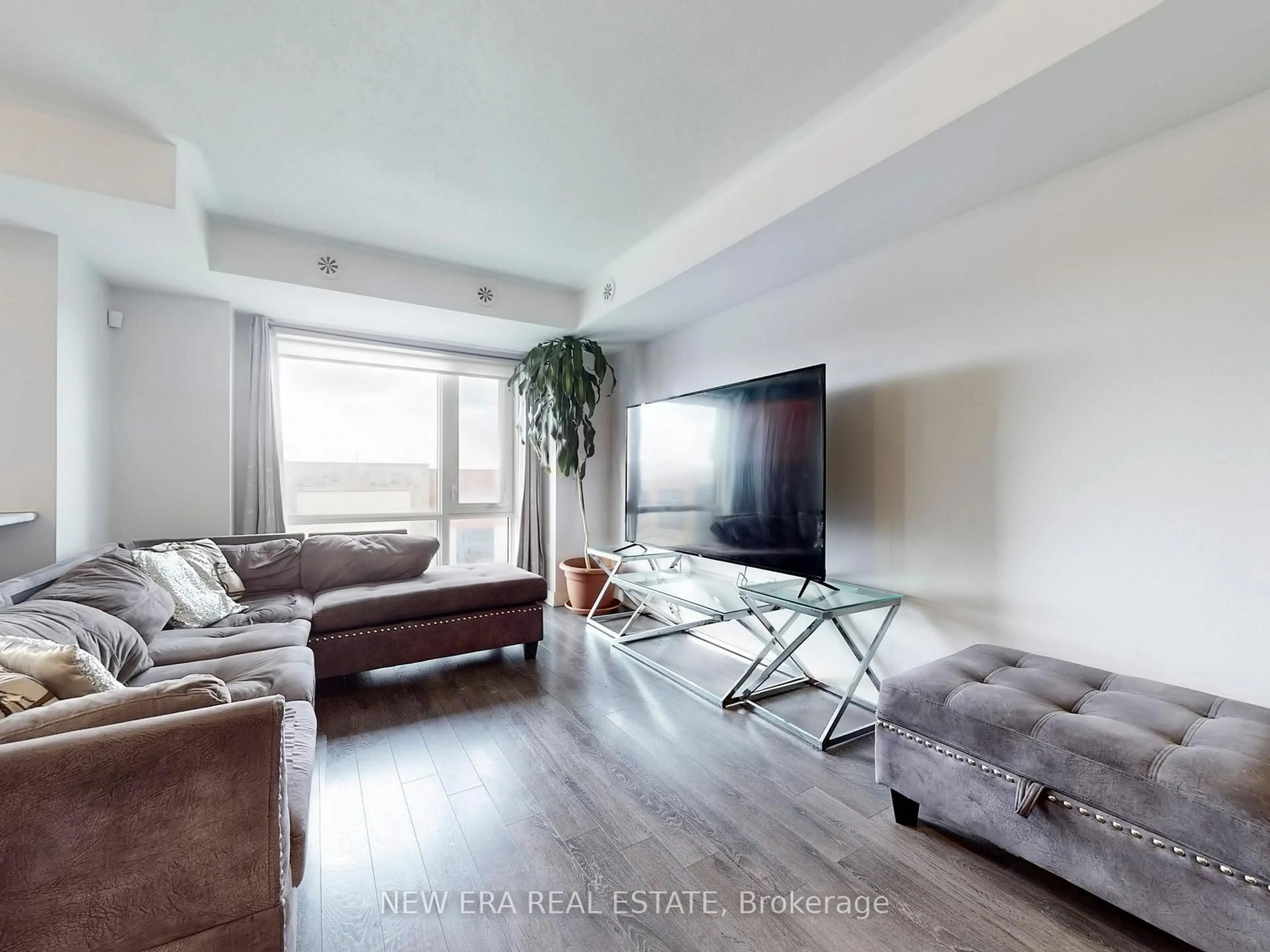 Living room with furniture, unknown for 100 Dufay Rd #12, Brampton Ontario L7A 4S3