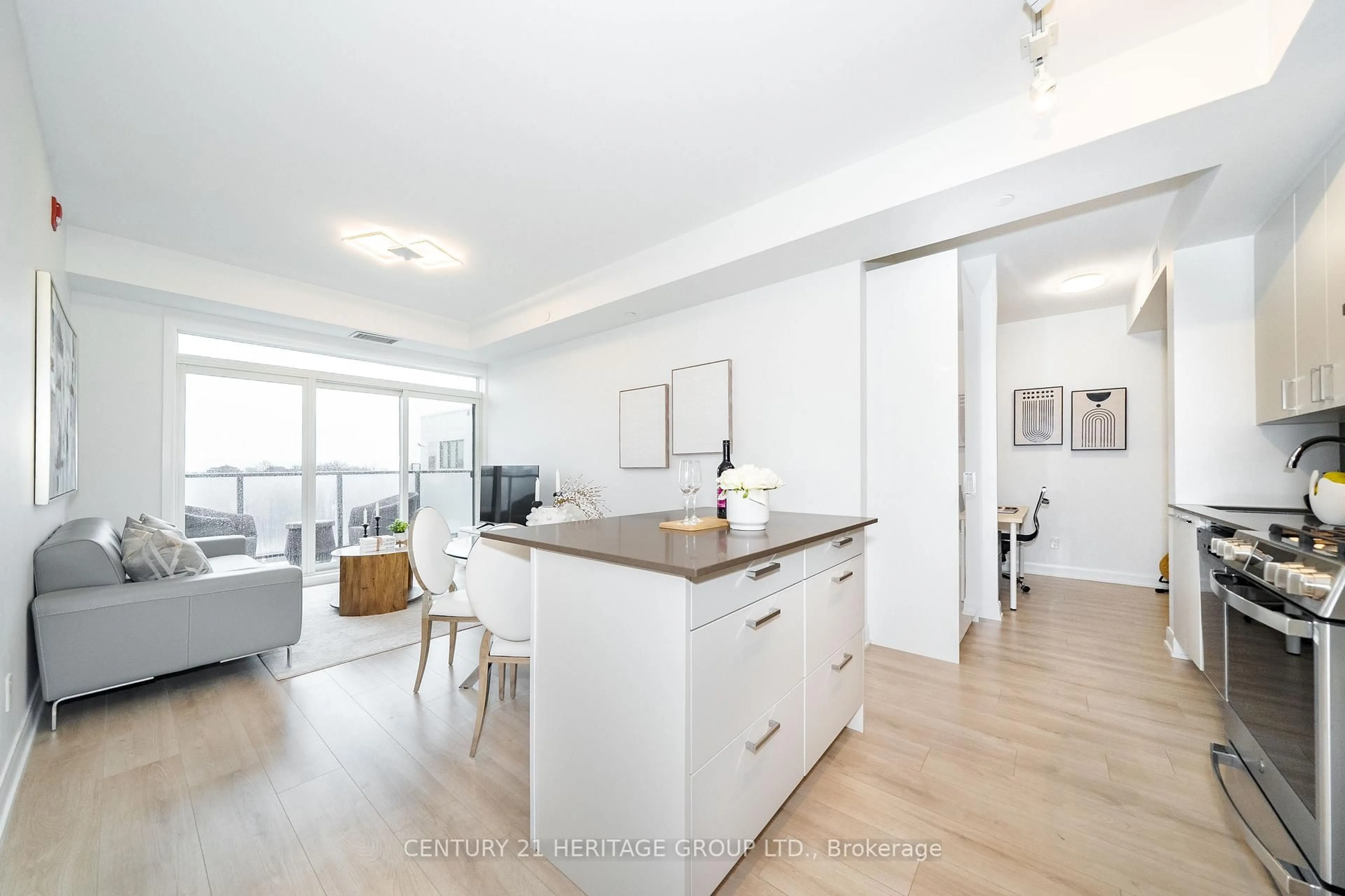 Open concept kitchen, wood/laminate floor for 385 Osler St #610, Toronto Ontario M6N 0B2
