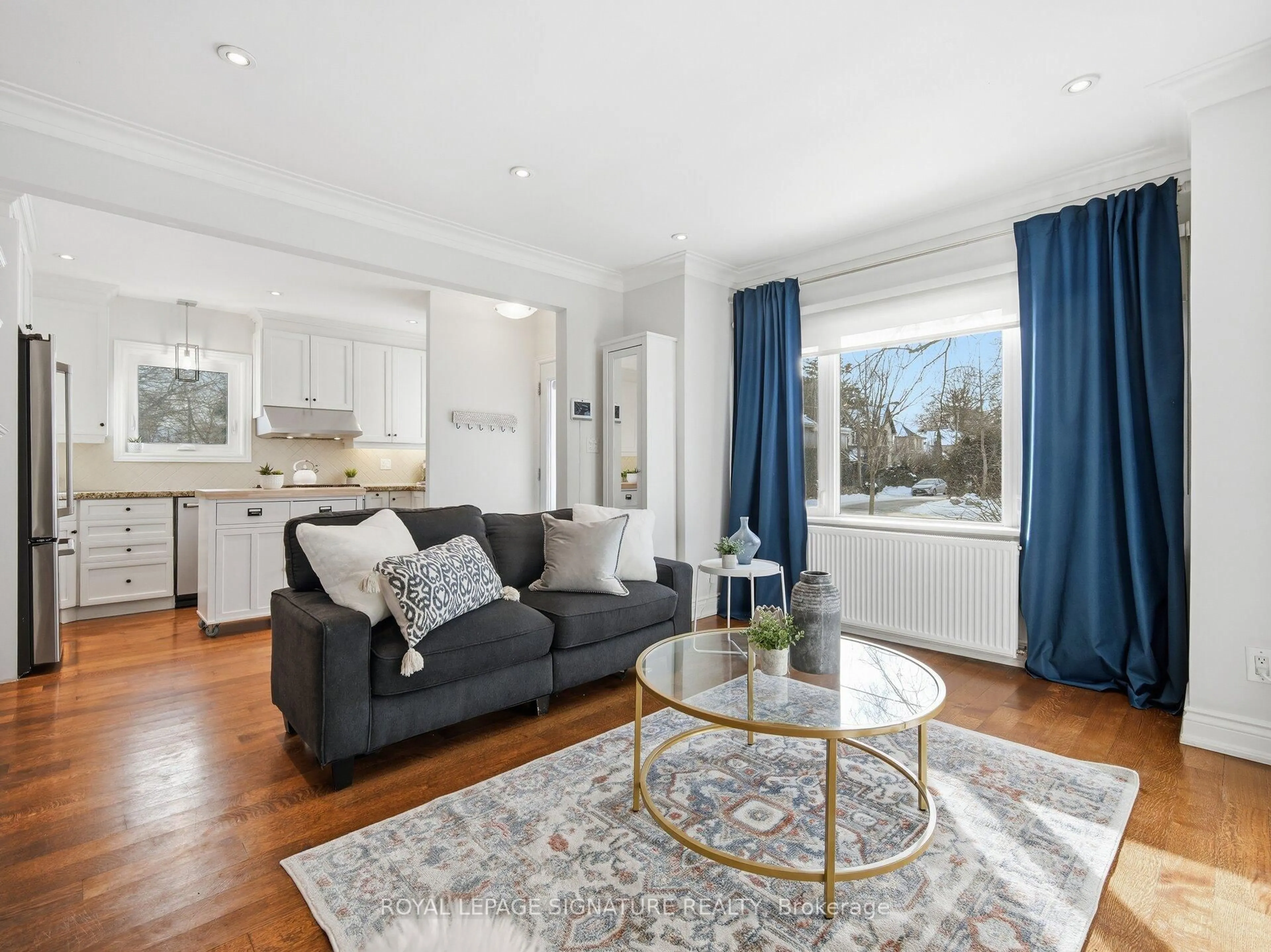 Living room with furniture, wood/laminate floor for 205 Prince Edward Dr, Toronto Ontario M8Y 3X1