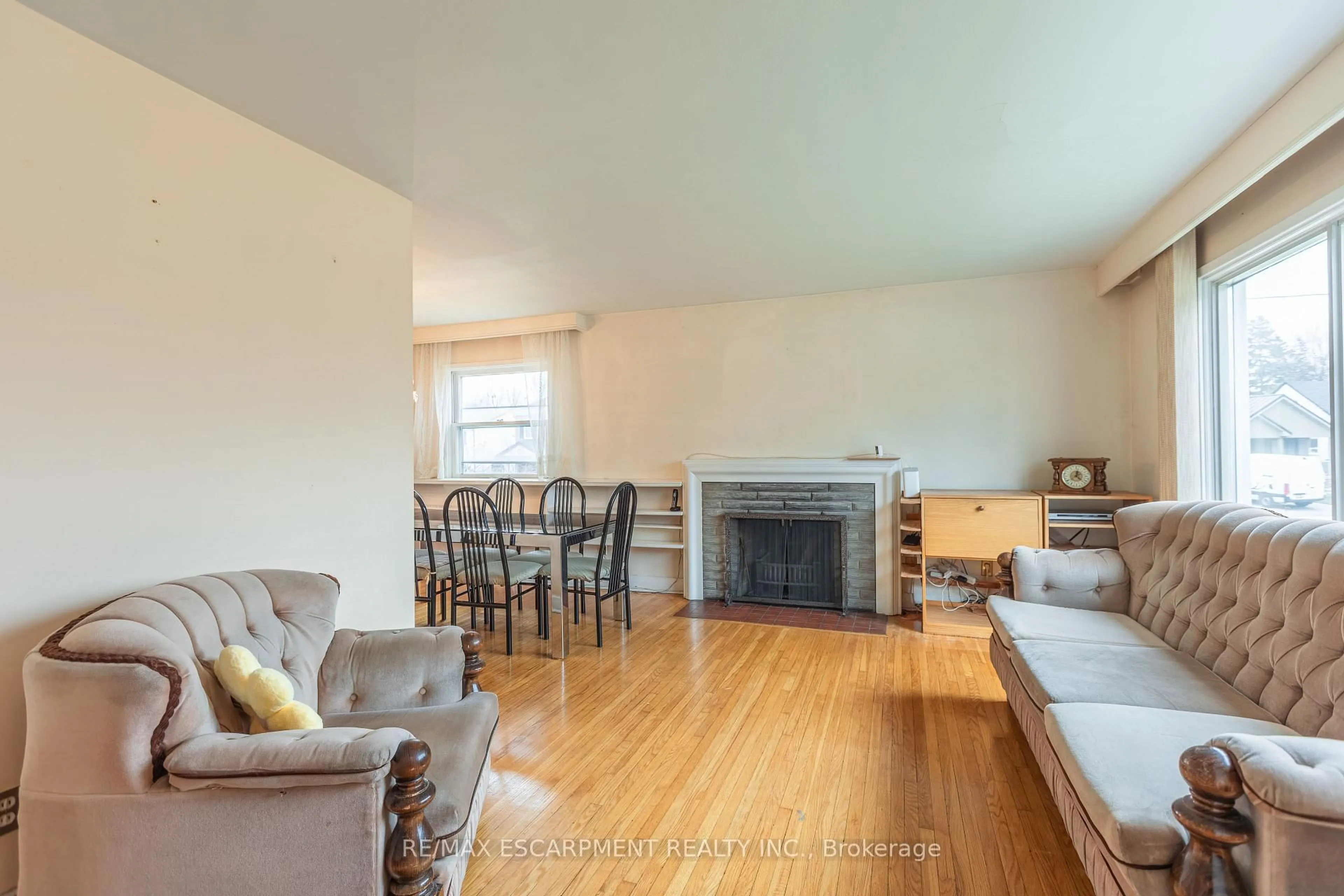 Living room with furniture, wood/laminate floor for 1 Snaresbrook Dr, Toronto Ontario M9W 2N5