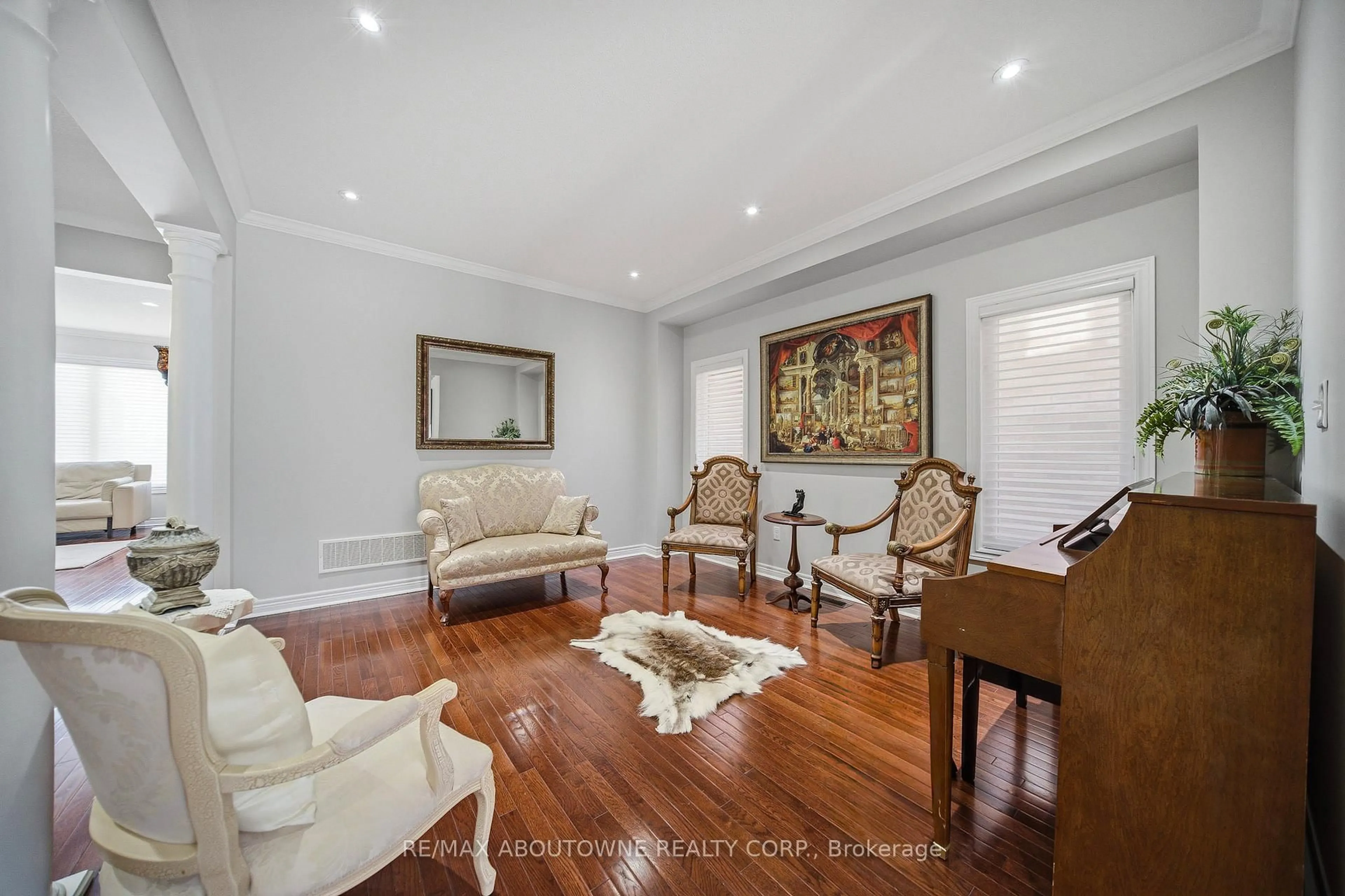 Living room with furniture, wood/laminate floor for 884 Stoutt Cres, Milton Ontario L9T 7R1