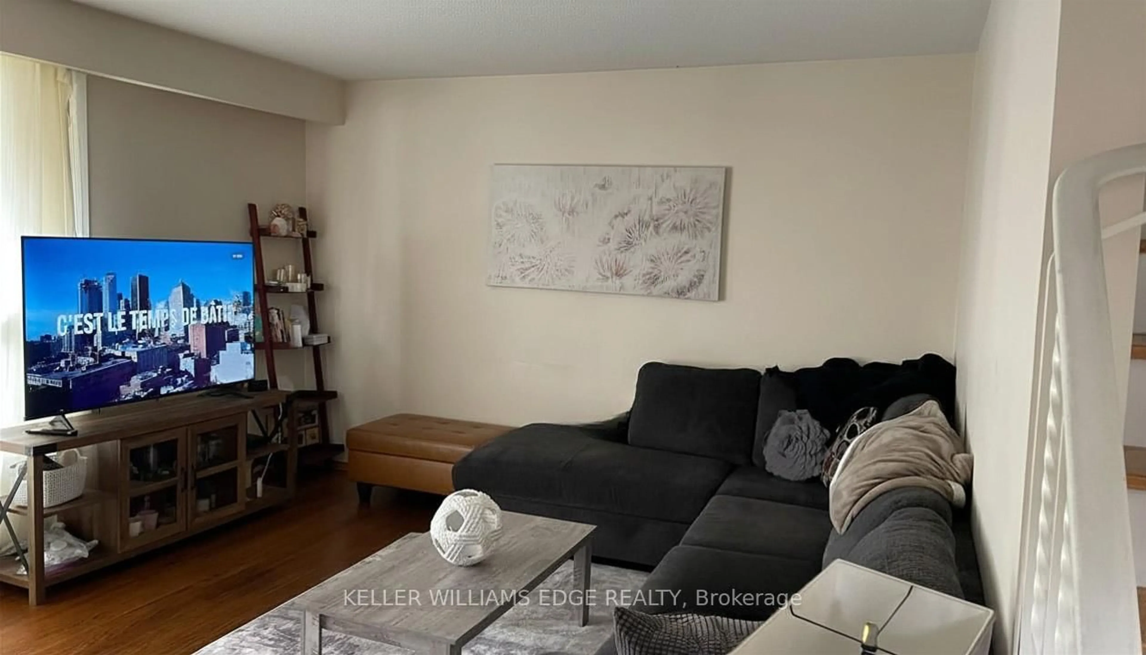 Living room with furniture, wood/laminate floor for 4026 Longmoor Dr #12, Burlington Ontario L7L 1X2