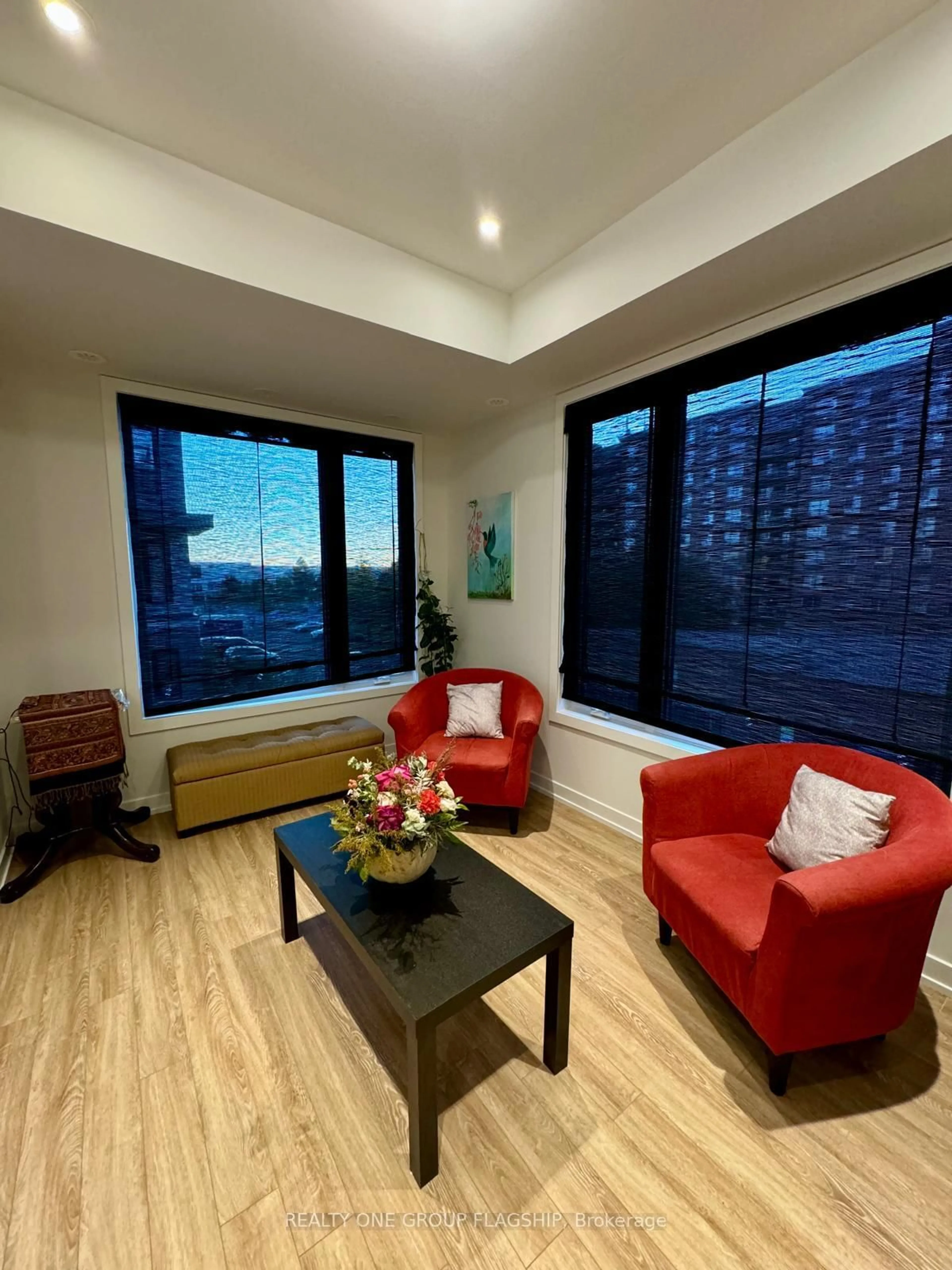 Living room with furniture, wood/laminate floor for 3421 Ridgeway Dr #11, Mississauga Ontario L5L 5T3