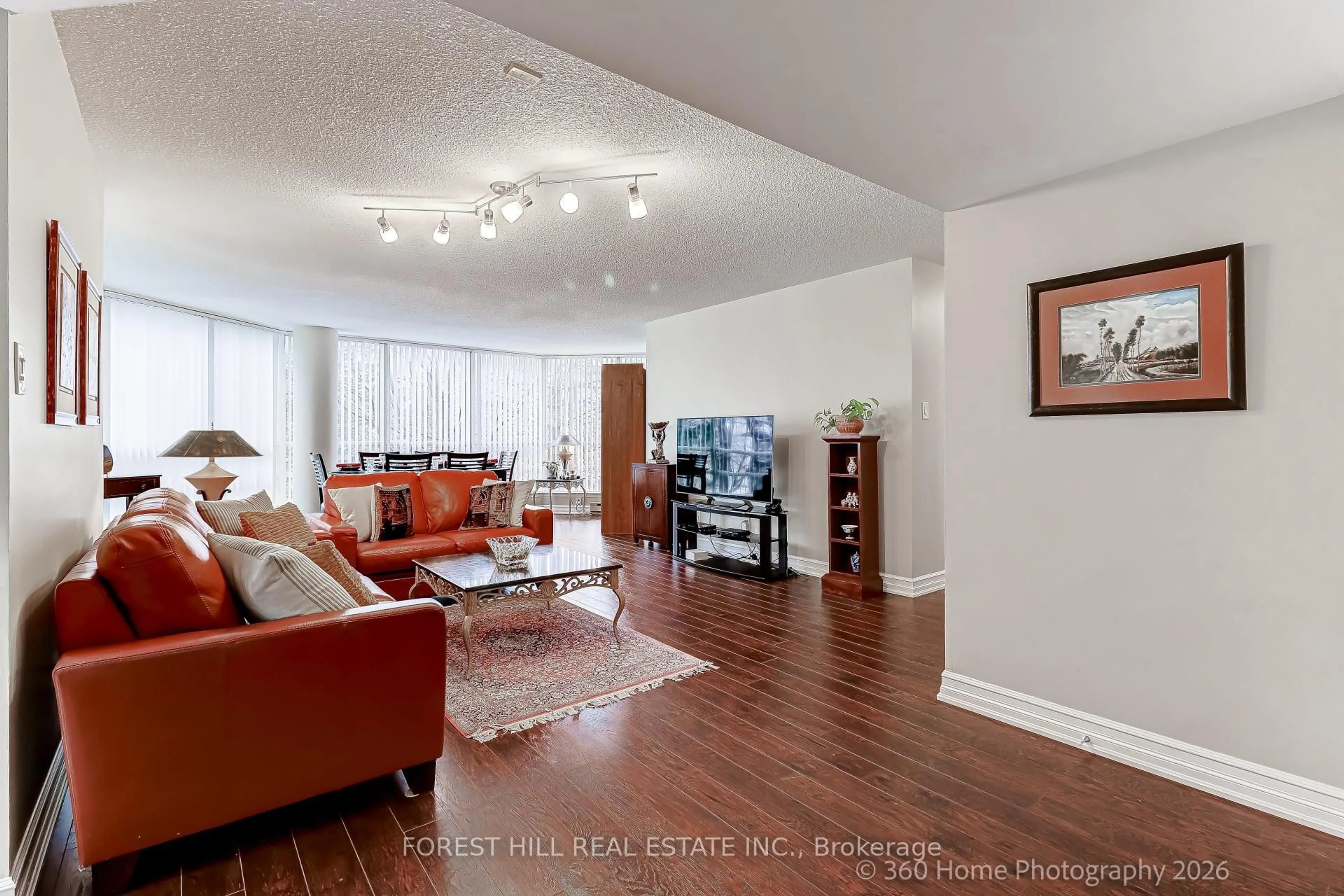 Living room with furniture, wood/laminate floor for 45 Kingsbridge Garden Circ #204, Mississauga Ontario L5R 3K4