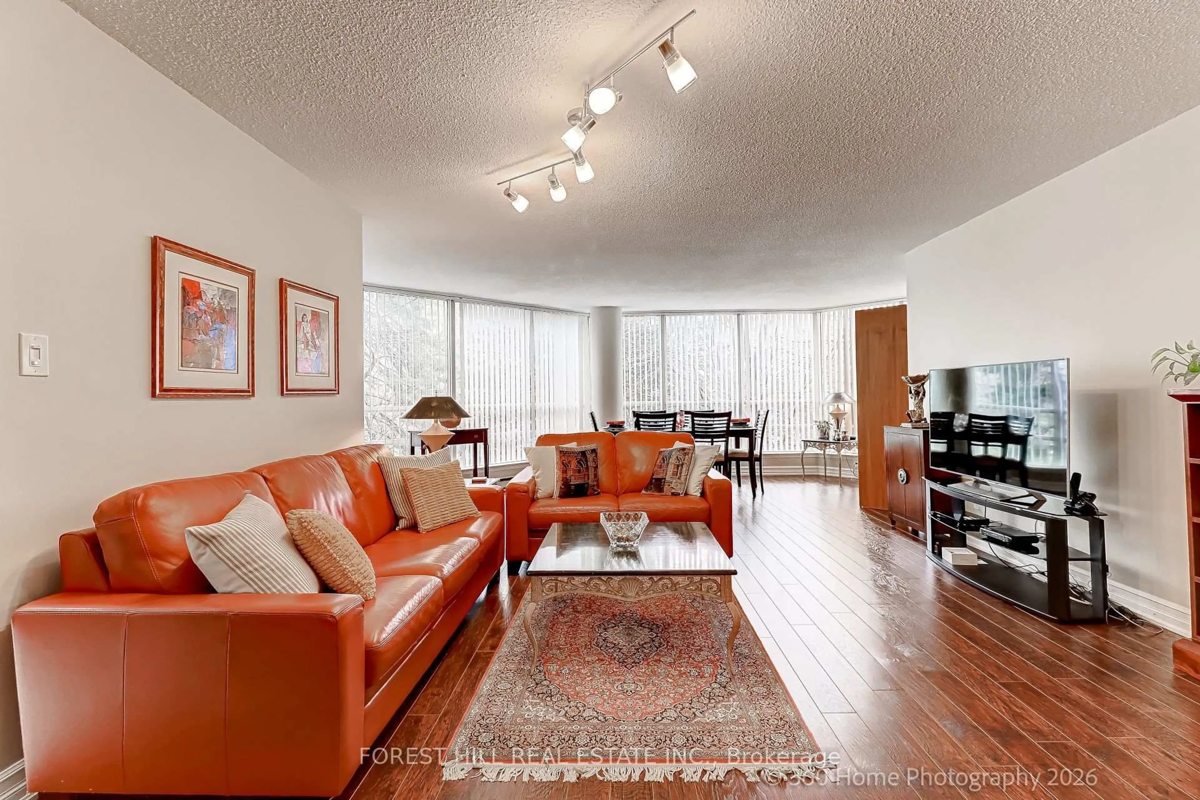 Living room with furniture, wood/laminate floor for 45 Kingsbridge Garden Circ #204, Mississauga Ontario L5R 3K4