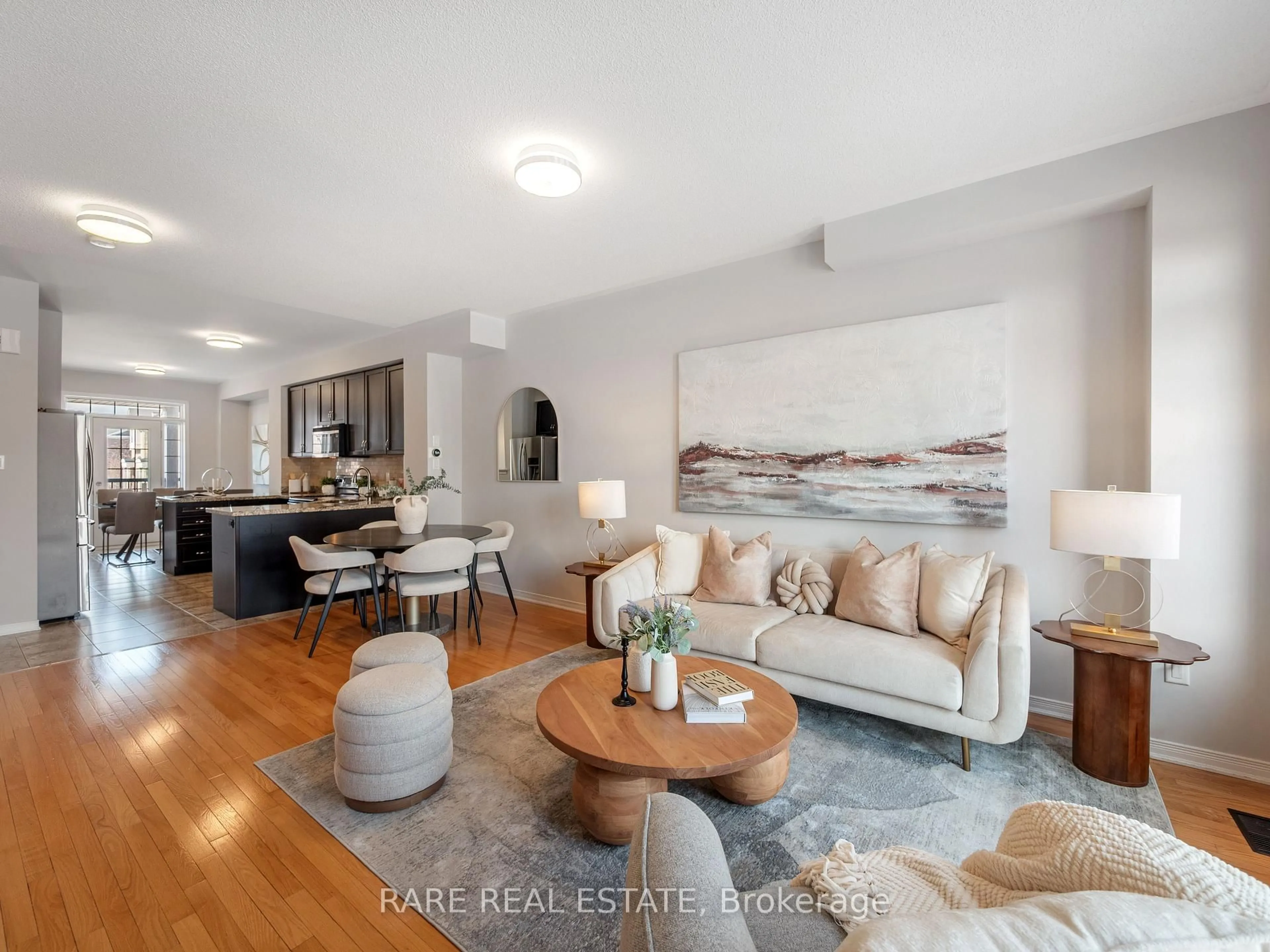Living room with furniture, wood/laminate floor for 7182 Triumph Lane, Mississauga Ontario L5N 0C5