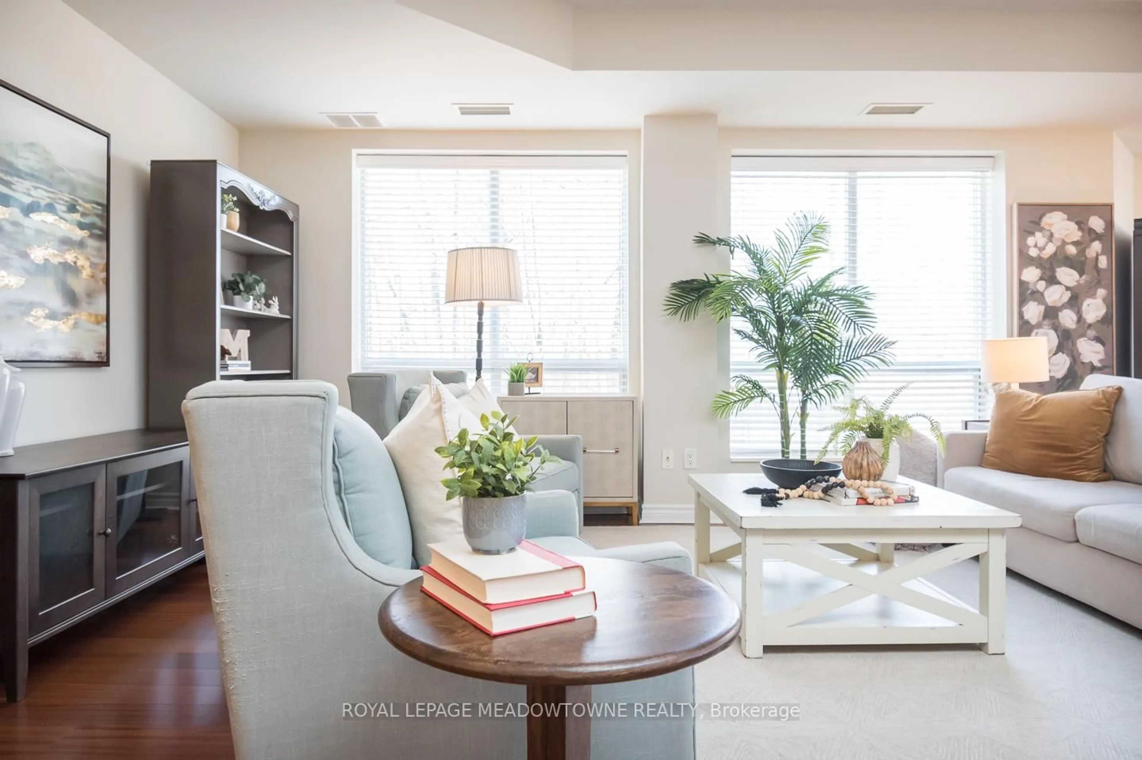 Living room with furniture, wood/laminate floor for 483 Faith Dr #311, Mississauga Ontario L5R 0A1