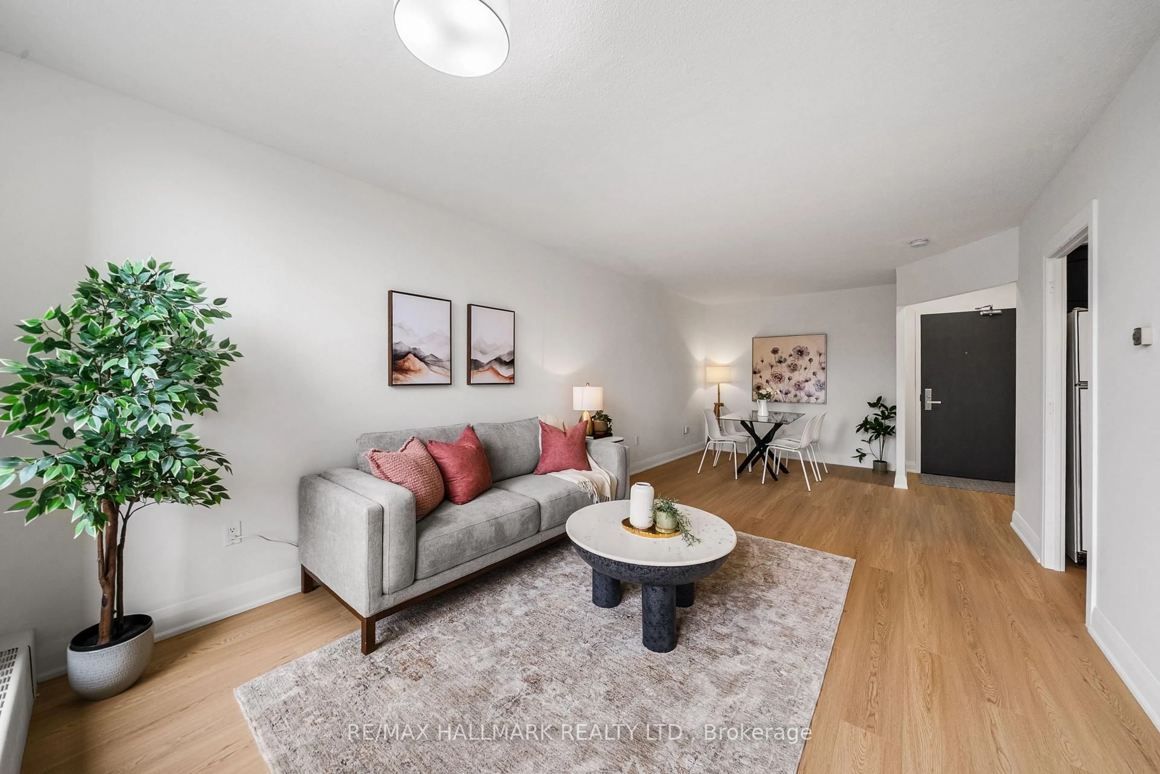 Living room with furniture, wood/laminate floor for 35 Ormskirk Ave #209, Toronto Ontario M6S 1A8