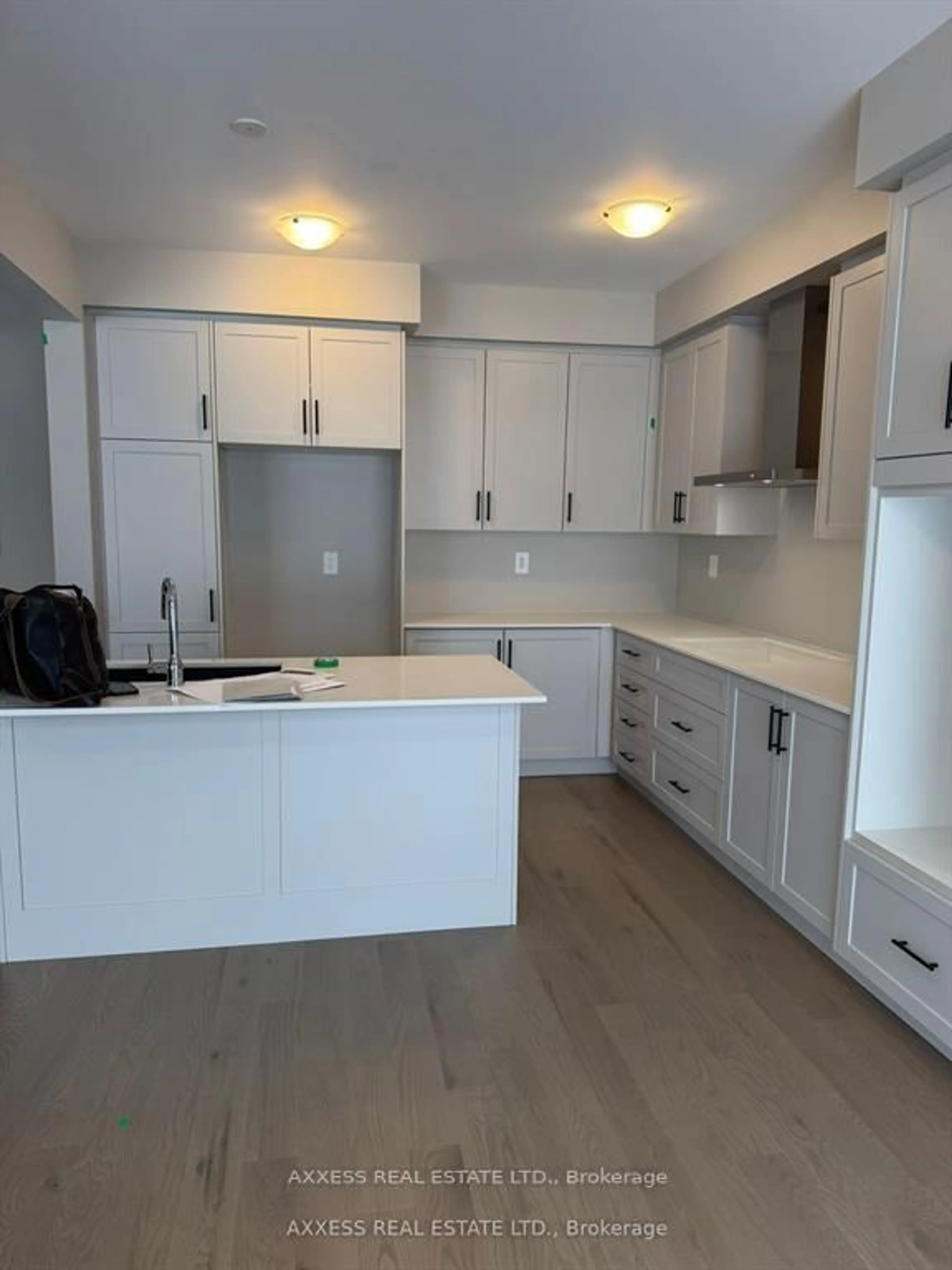 Open concept kitchen, wood/laminate floor for 11 Misted Breeze St, Brampton Ontario L6Y 6M1