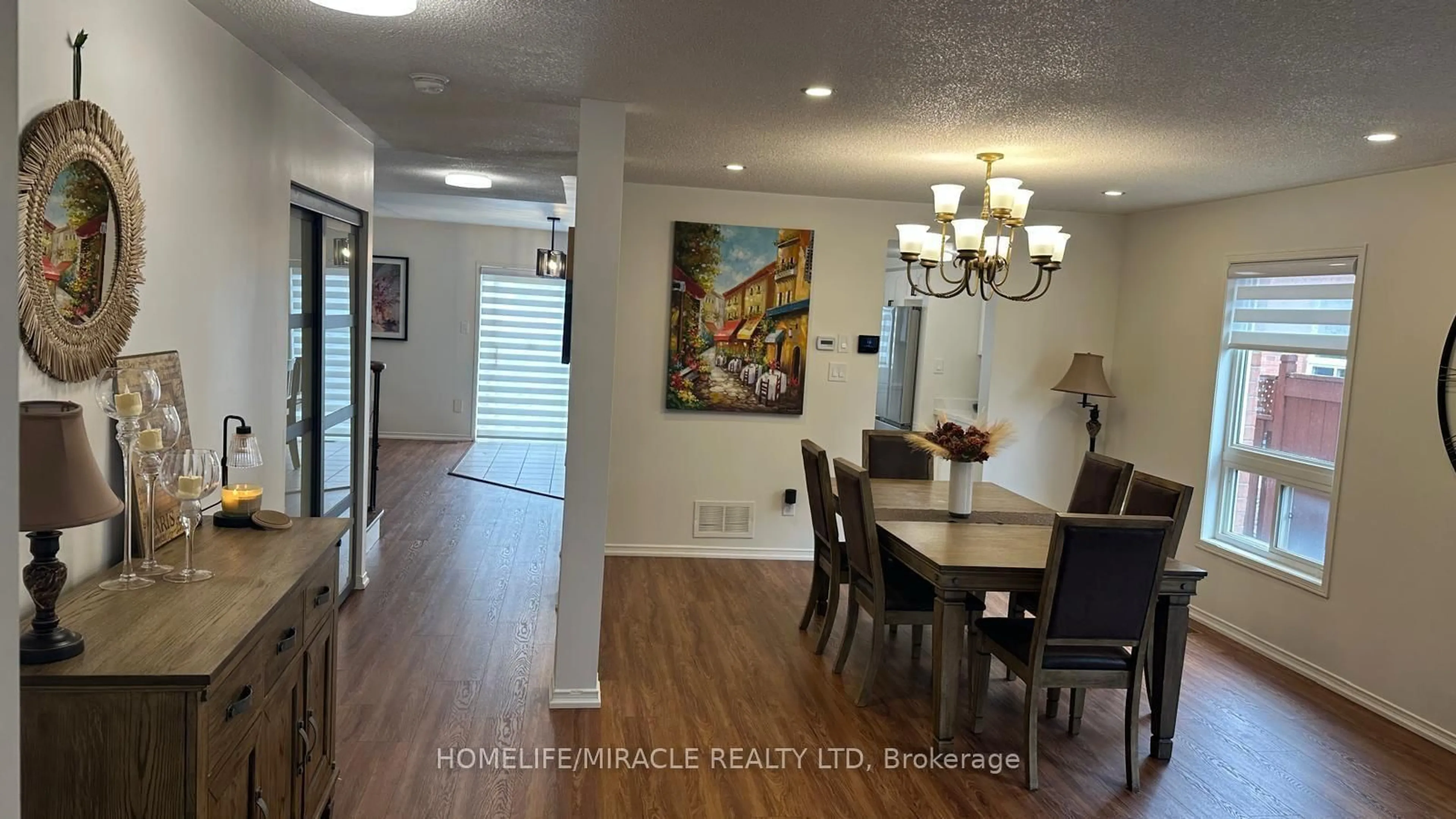 Dining room, wood/laminate floor for 65 Fairhill Ave, Brampton Ontario L7A 2E8