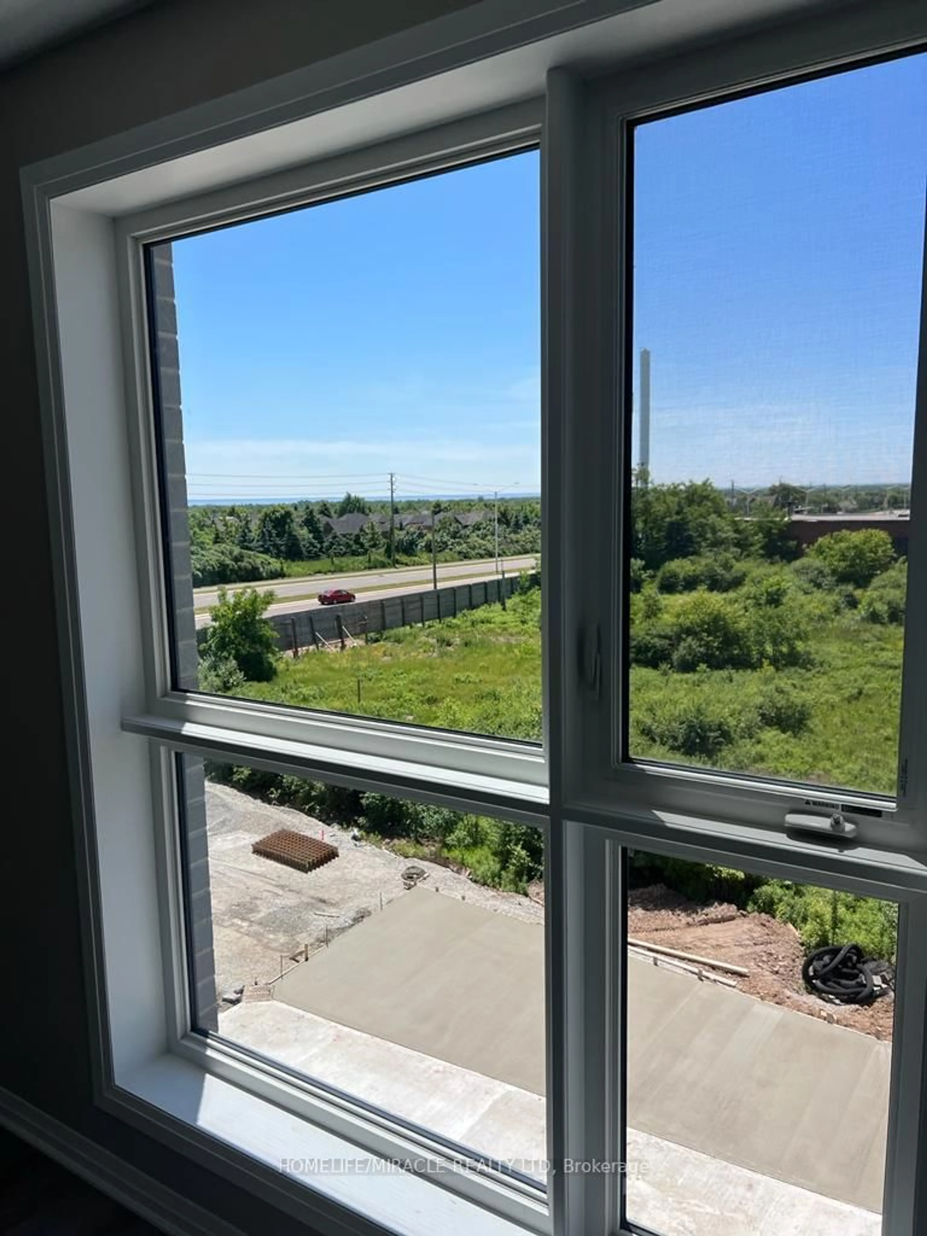 Balcony in the apartment, city buildings view from balcony for 95 Dundas St #219, Oakville Ontario L6M 5N4