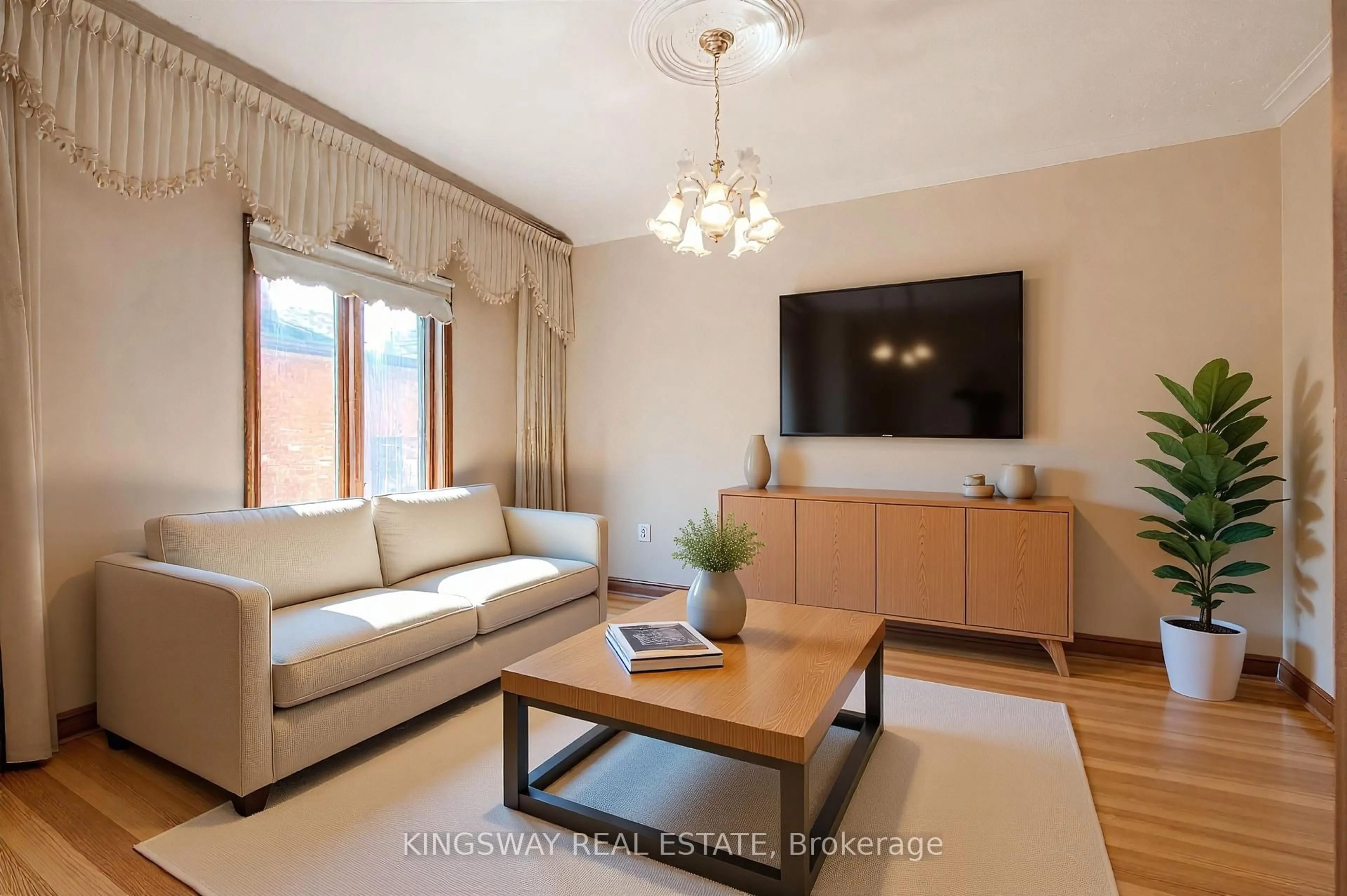 Living room with furniture, wood/laminate floor for 27 Mulholland Ave, Toronto Ontario M6A 2S1