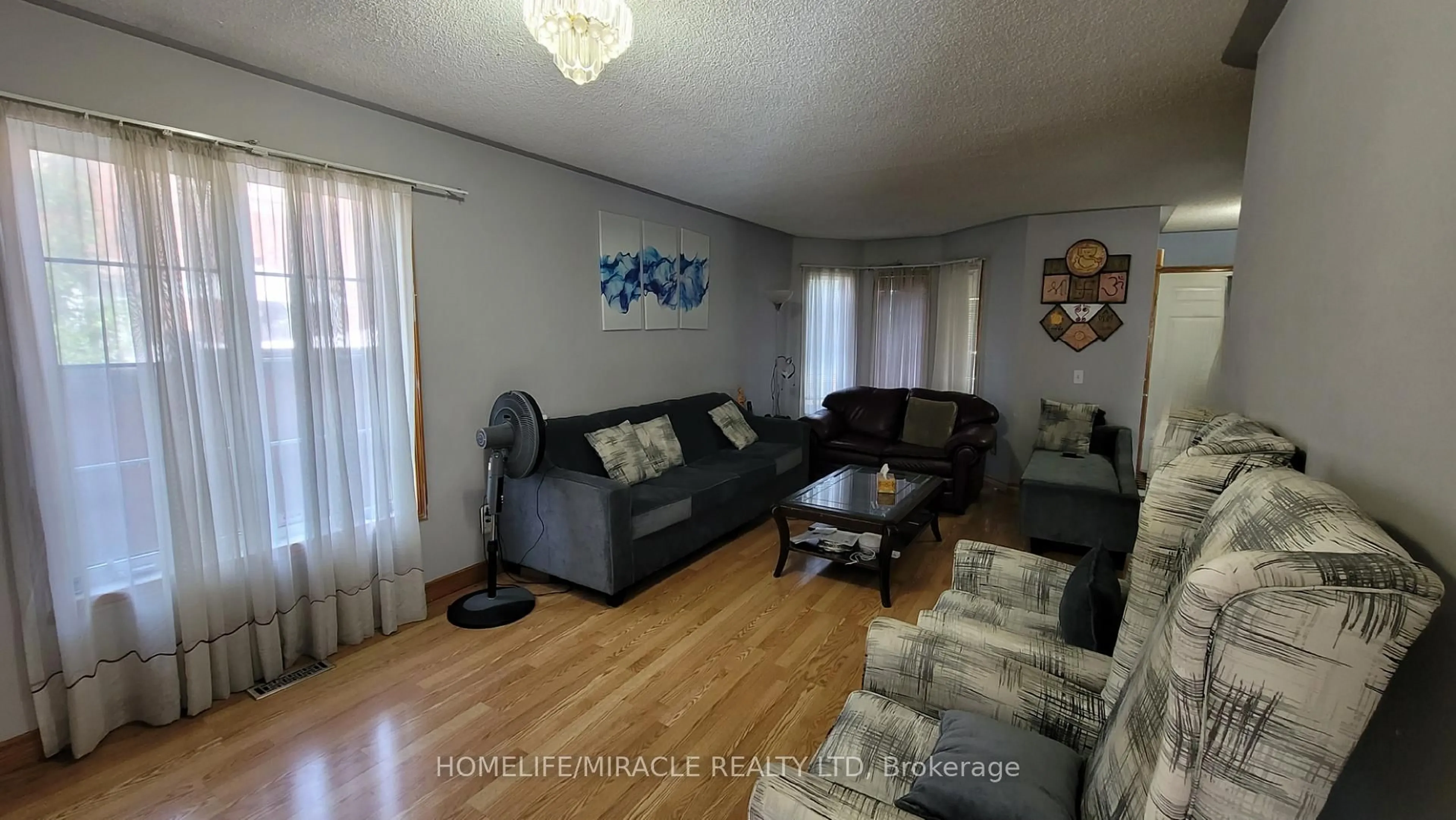 Living room with furniture, unknown for 144 Sandyshores Dr, Brampton Ontario L6R 2M3