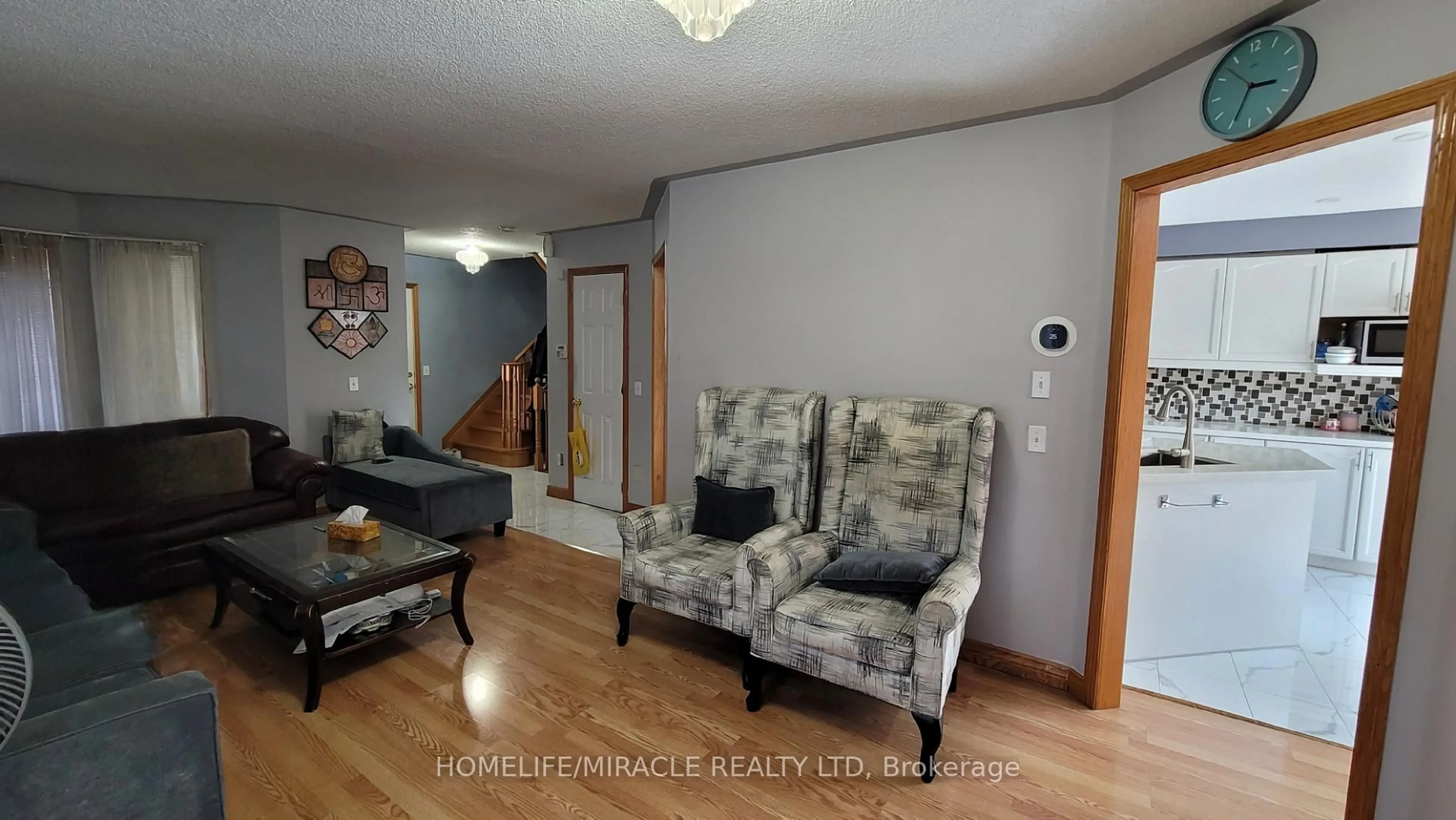 Living room with furniture, wood/laminate floor for 144 Sandyshores Dr, Brampton Ontario L6R 2M3