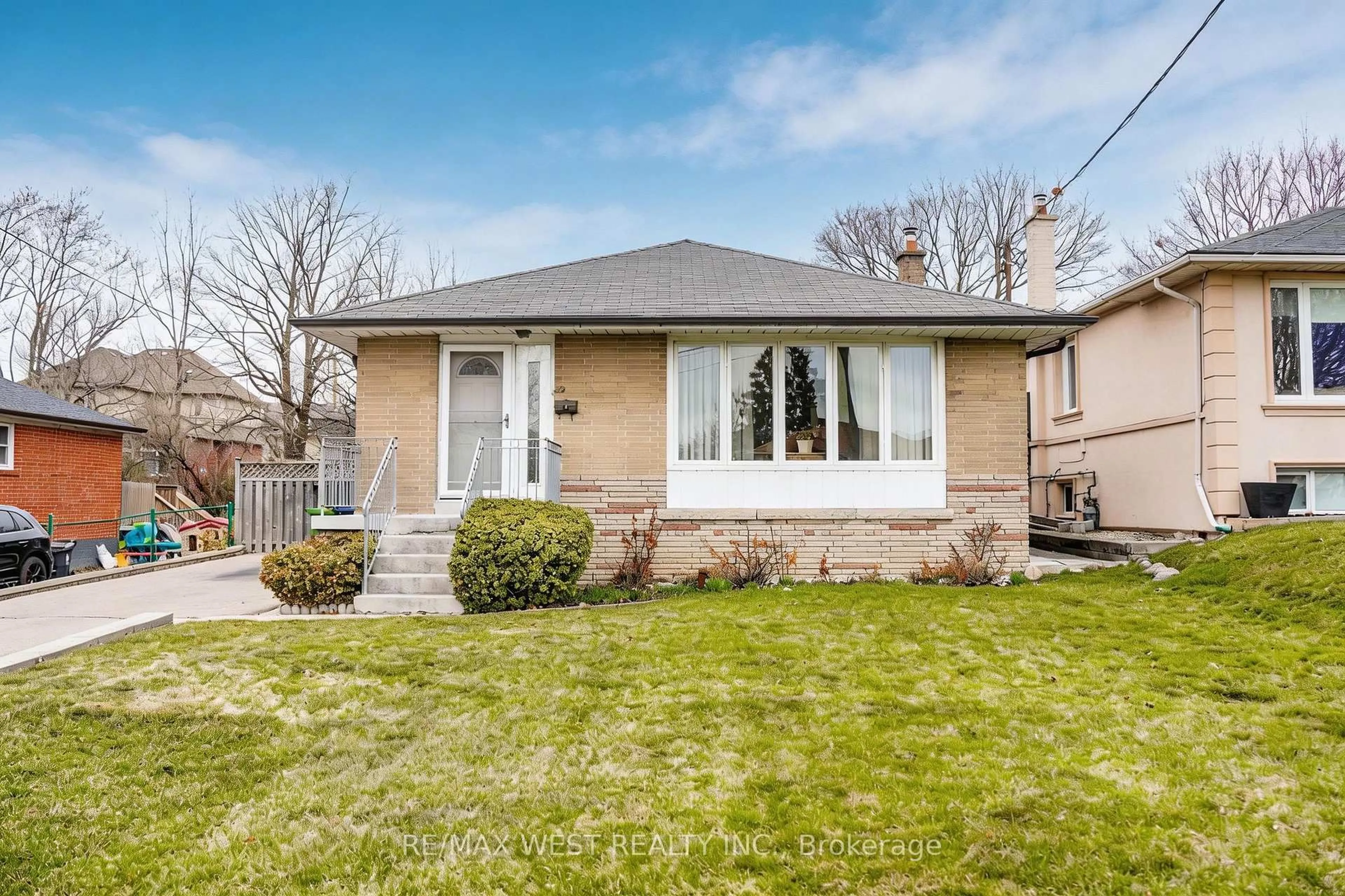 Home with brick exterior material, street for 32 Deevale Rd, Toronto Ontario M3M 1Z3