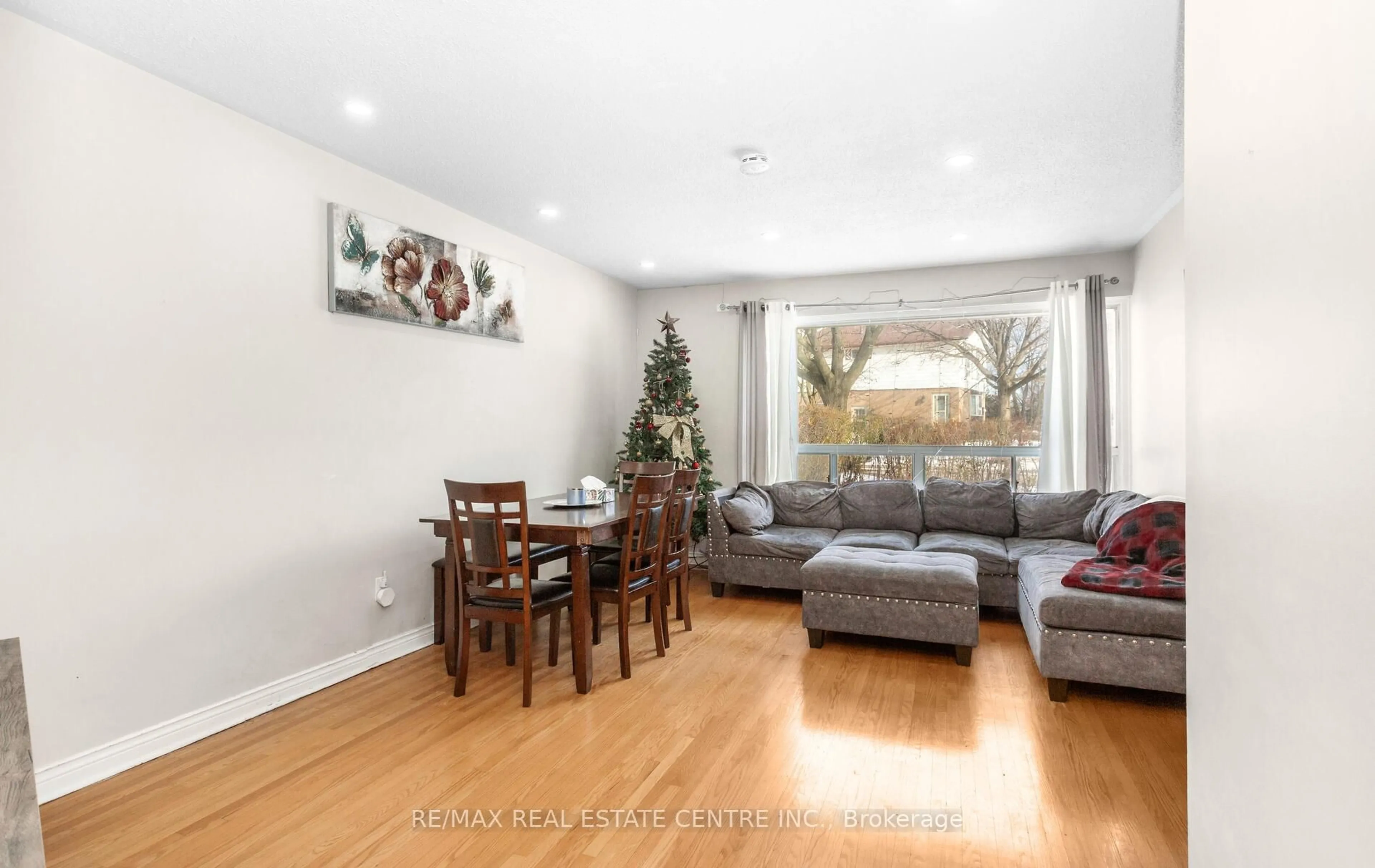 Living room with furniture, wood/laminate floor for 1 Tindale Rd, Brampton Ontario L6V 2G8