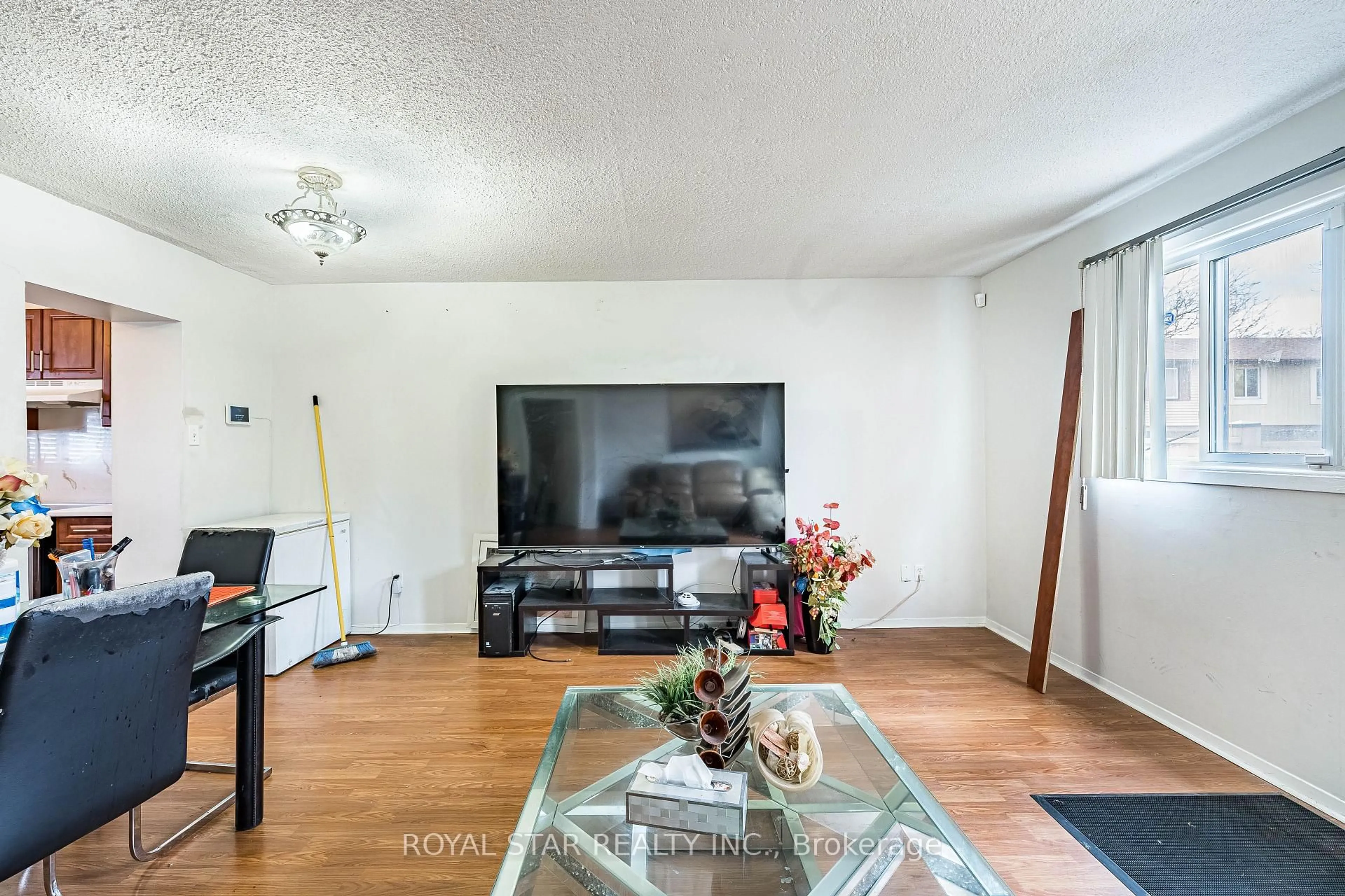 Living room with furniture, wood/laminate floor for 105 Hansen Rd #99, Brampton Ontario L6V 3C9
