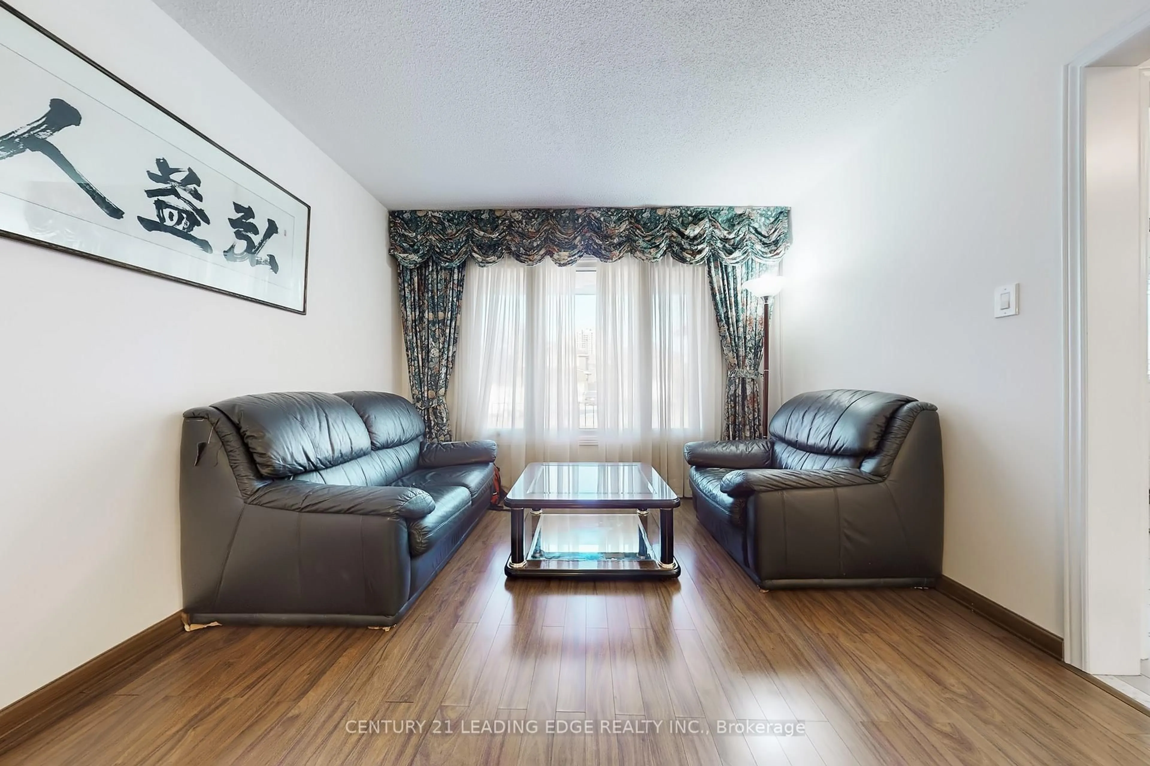 Living room with furniture, wood/laminate floor for 73 Hullrick Dr, Toronto Ontario M9W 6W6