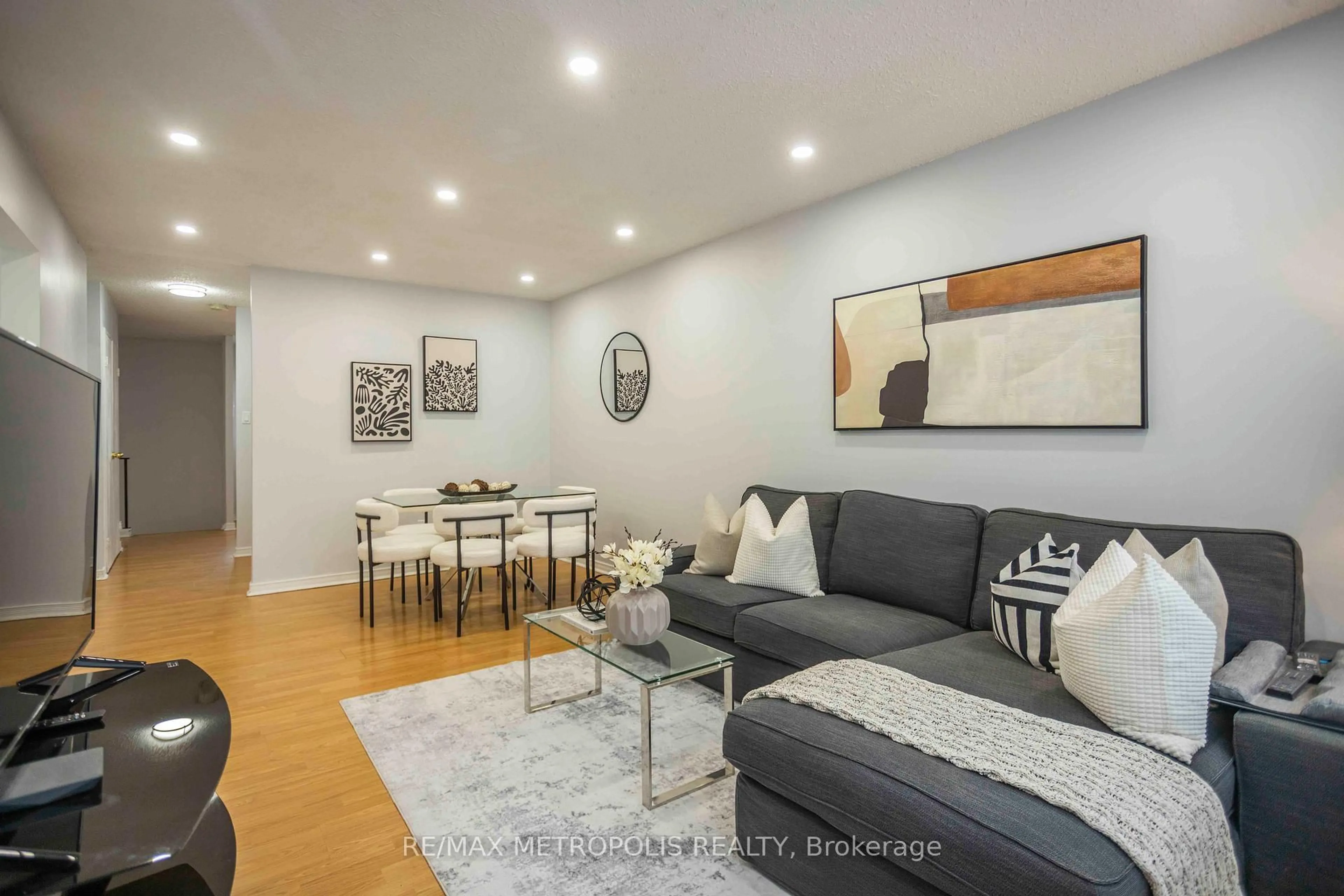 Living room with furniture, wood/laminate floor for 2170 Bromsgrove Rd #189, Mississauga Ontario L5J 4J2