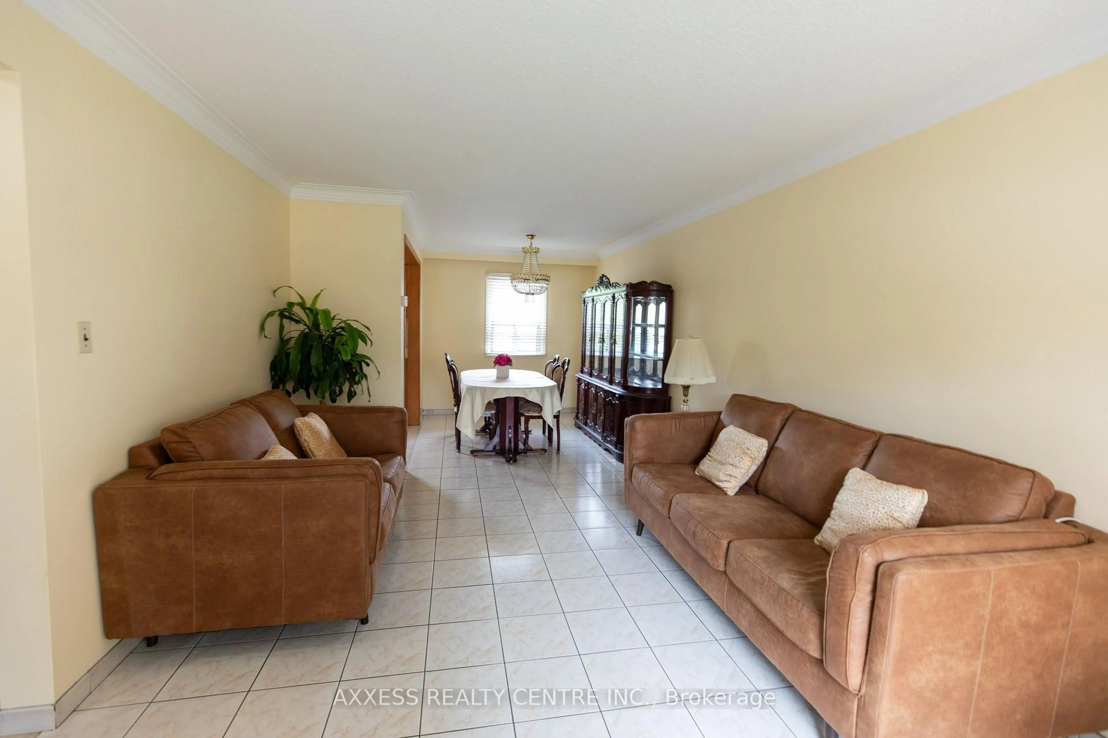 Living room with furniture, ceramic/tile floor for 76 Dombey Rd, Toronto Ontario M3L 1P2