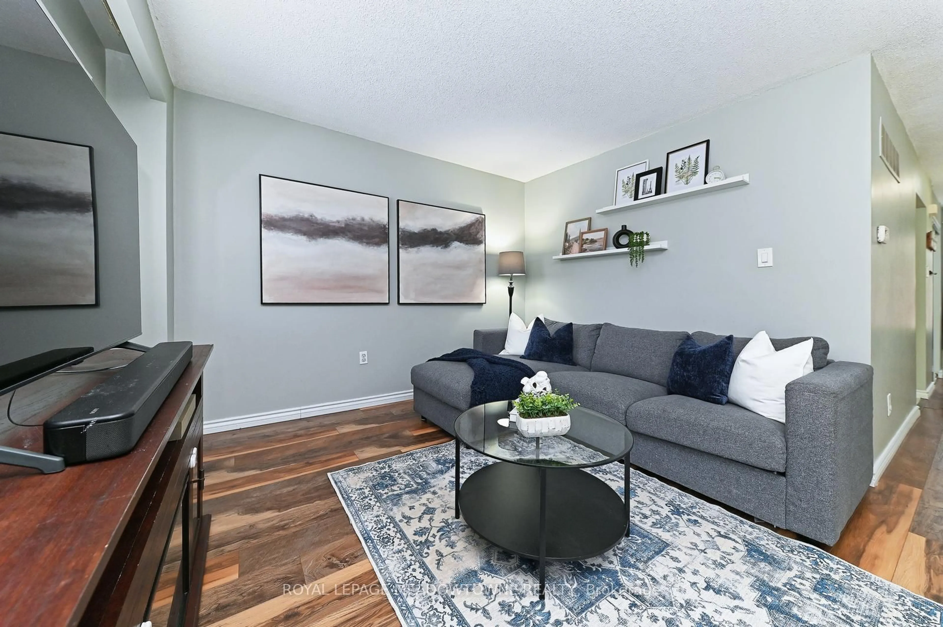 Living room with furniture, wood/laminate floor for 80 Lynden Circ #74, Halton Hills Ontario L7G 4Y8