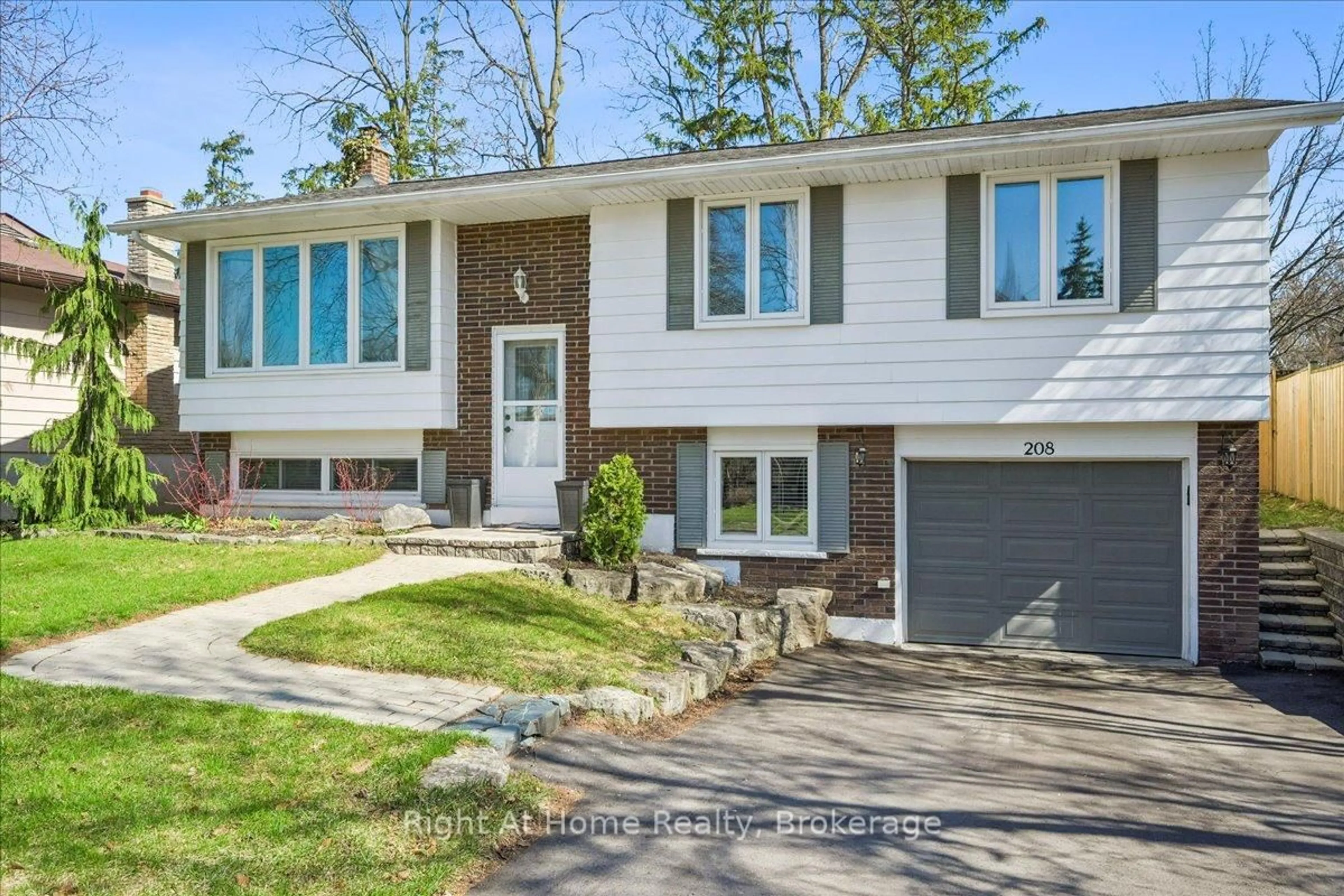 Home with vinyl exterior material, street for 208 Mccraney St, Oakville Ontario L6H 1H7