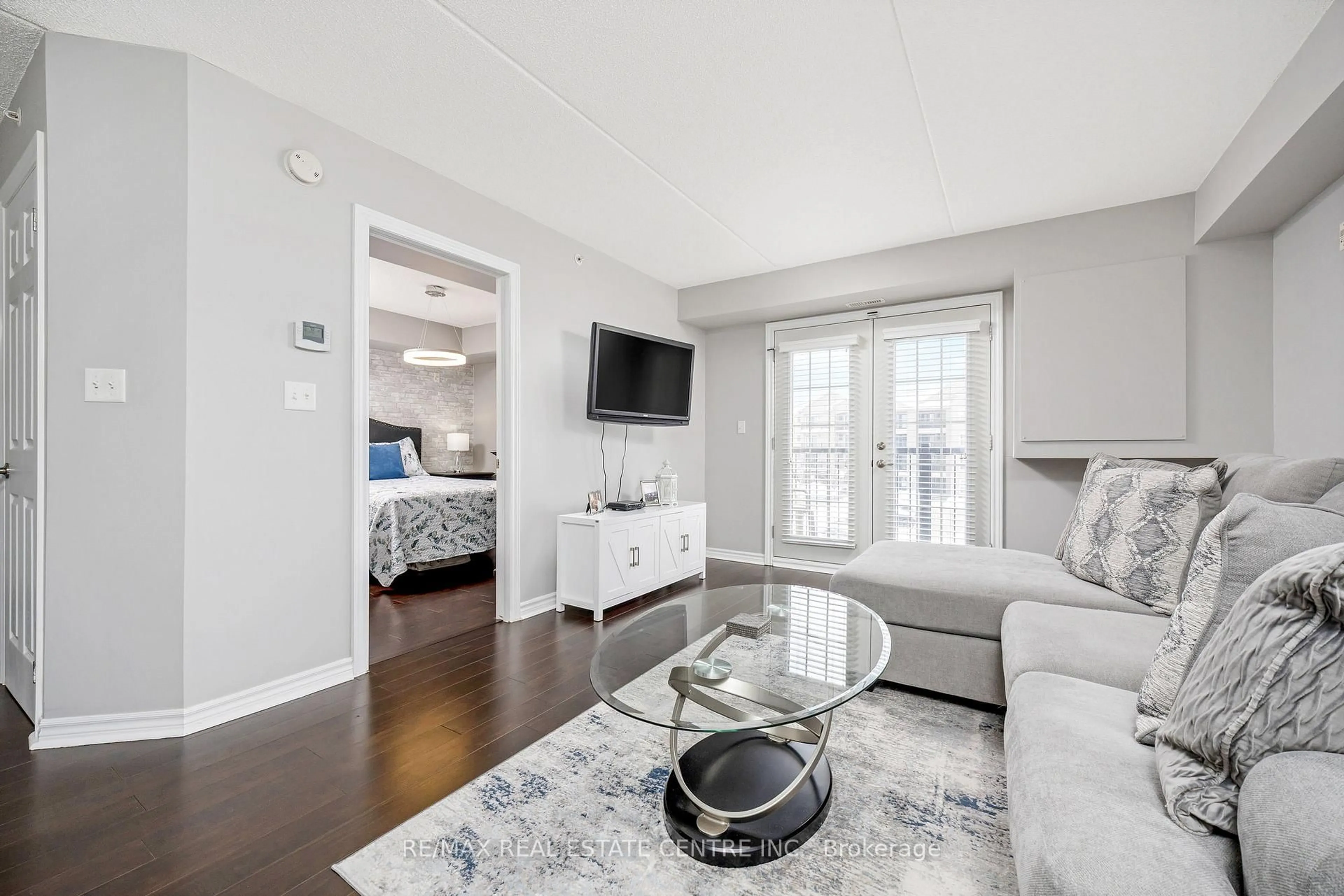 Living room with furniture, unknown for 1360 Main St #304, Milton Ontario L9T 7S5